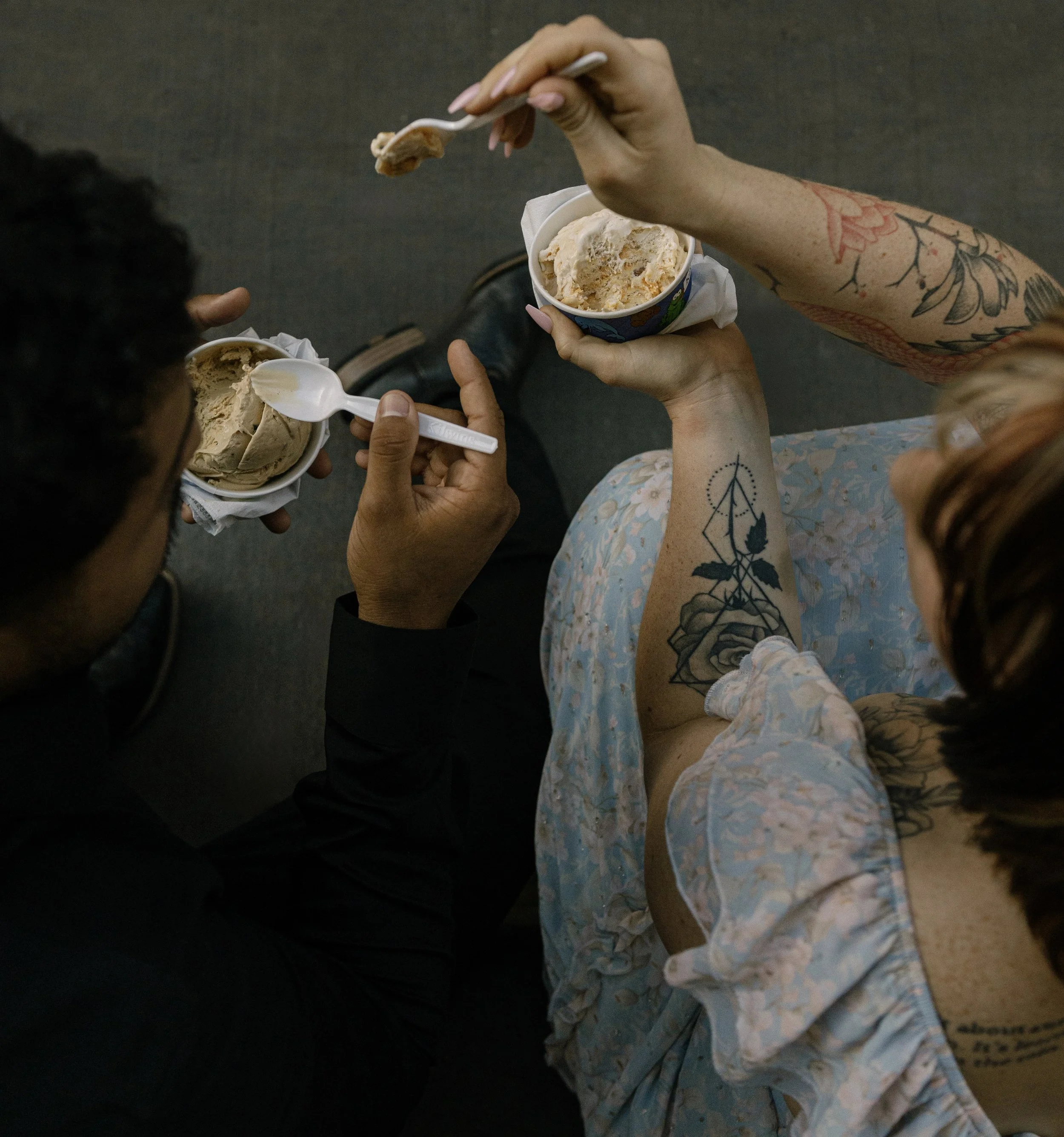 Couple sharing ice cream during photoshoot in downtown New Orleans. 