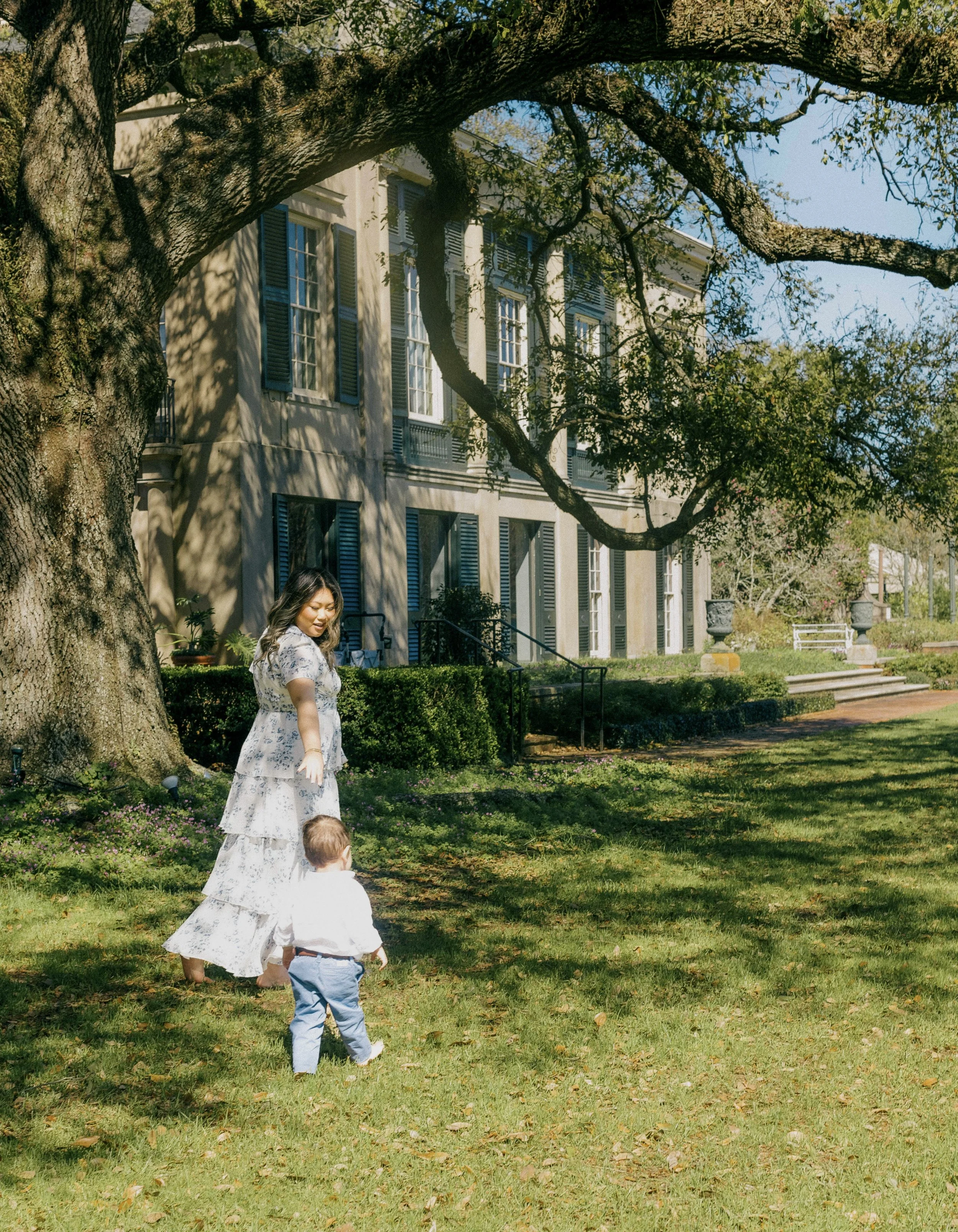 Sweet mom and baby moment captured during a garden session at Longue Vue in Metairie, LA.
