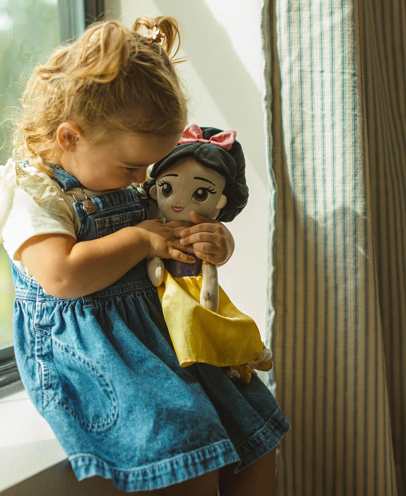 Young child photographed naturally at home during a documentary-style family session.