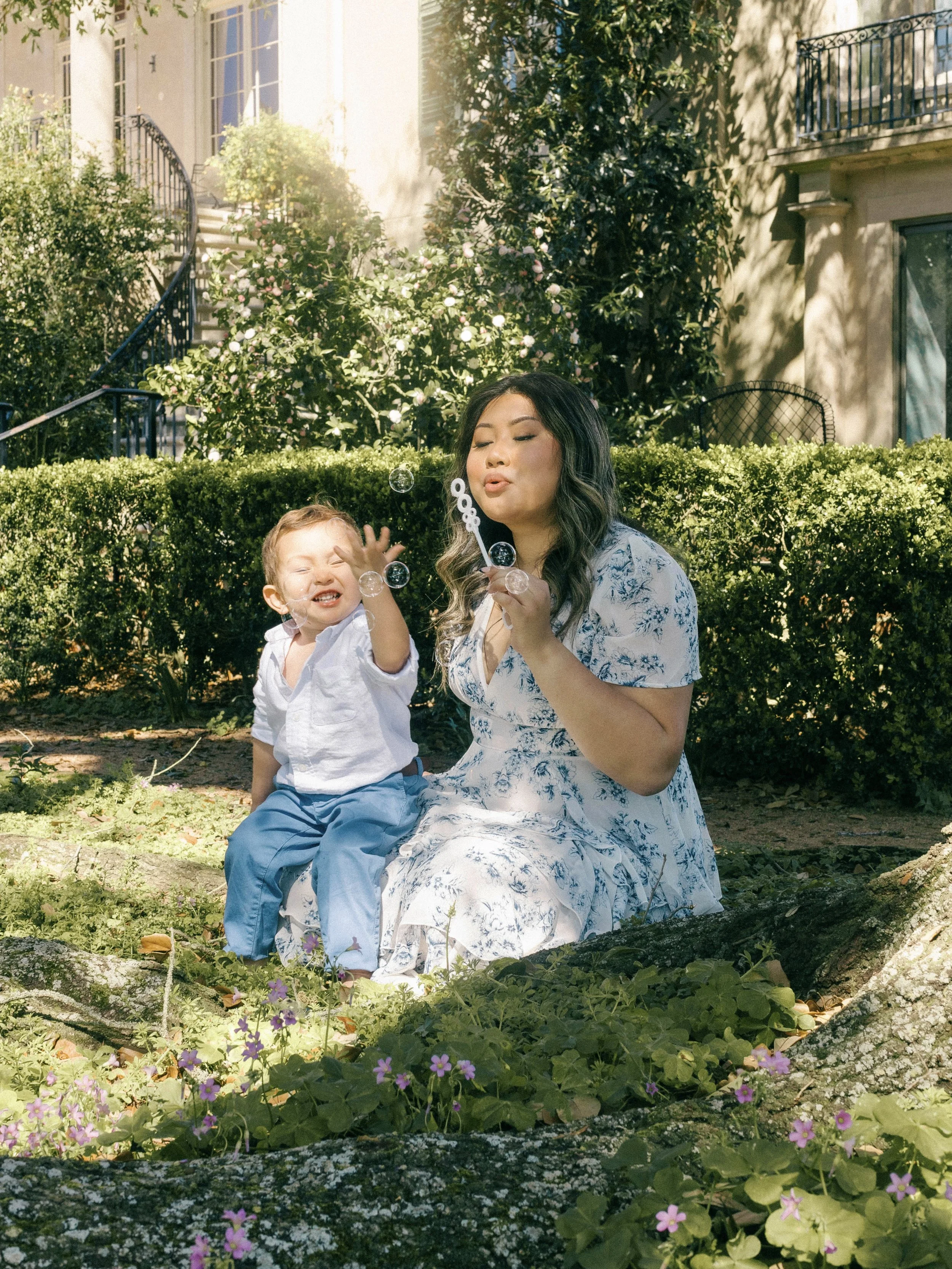 Emotional motherhood portrait in the New Orleans-area gardens of Longue Vue