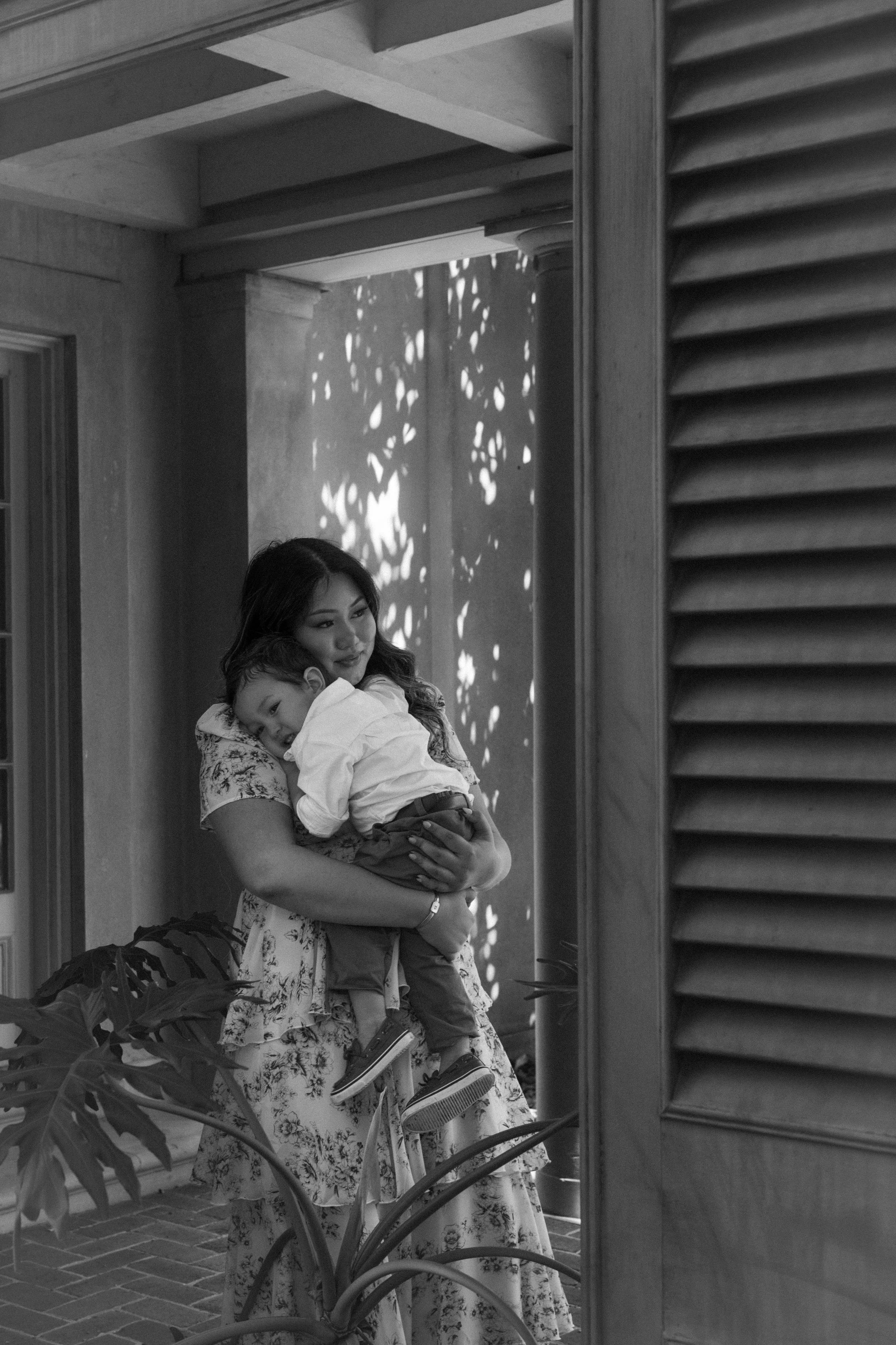 Authentic connection between mother and child captured at Longue Vue Gardens near New Orleans, LA.