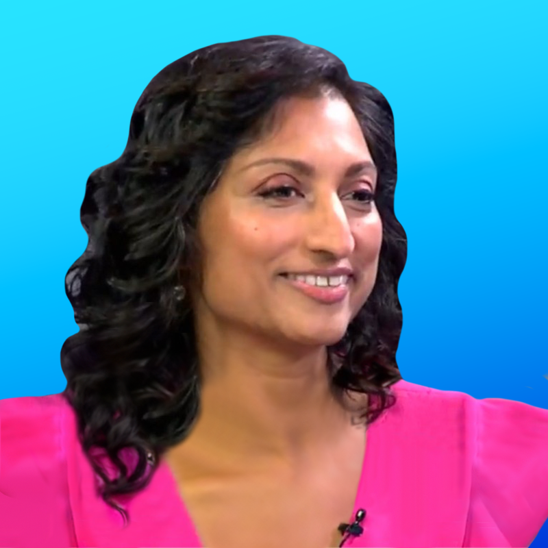 Mercy Mental Health - Smiling woman with curly hair wearing a pink top against a blue background.