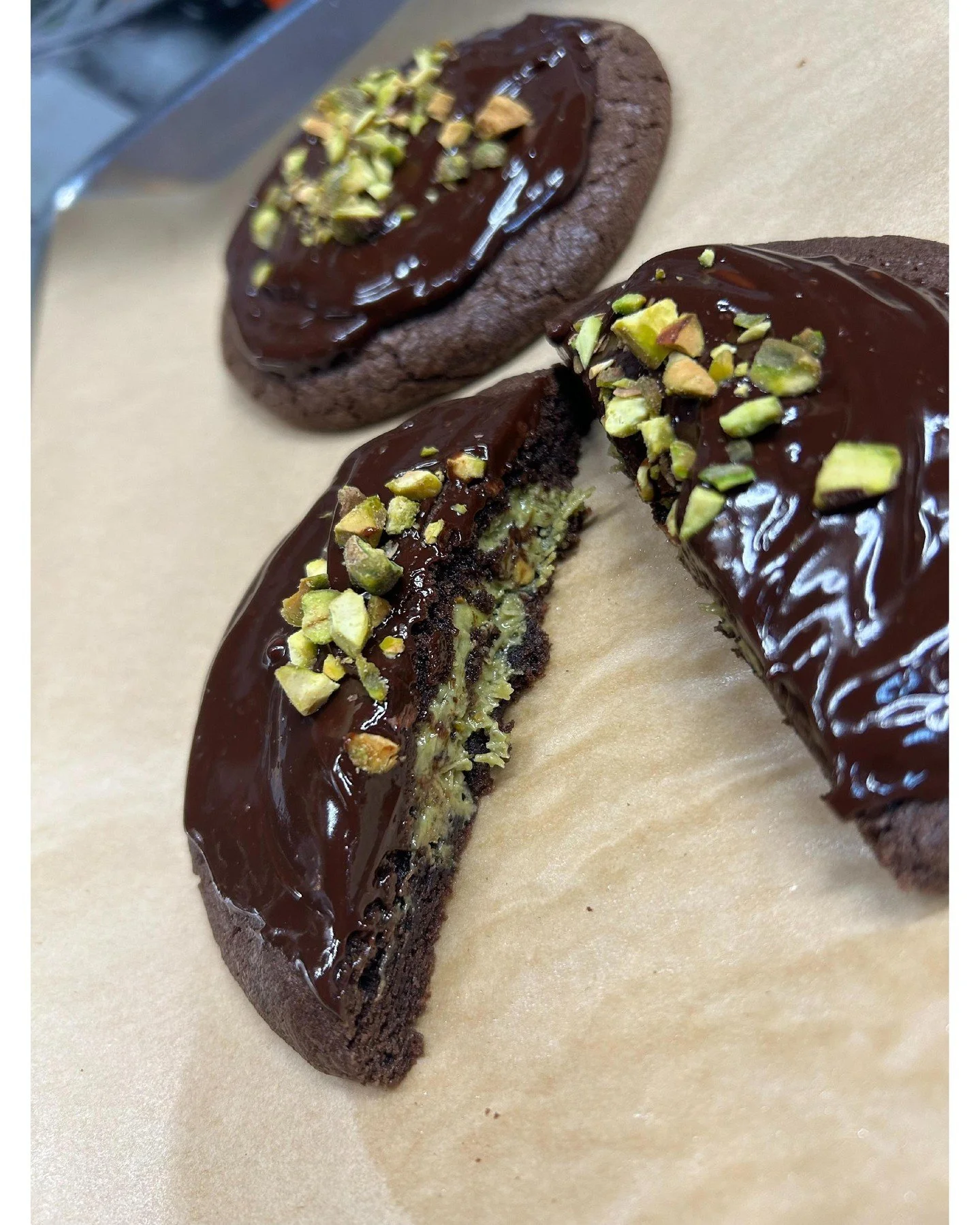 Exciting news! Our new Dubai Chocolate cookies are a delicious chocolate cookie with a rich Dubai filling, topped with creamy chocolate ganache and crunchy chopped pistachios. Can't wait for you to try these tomorrow!
