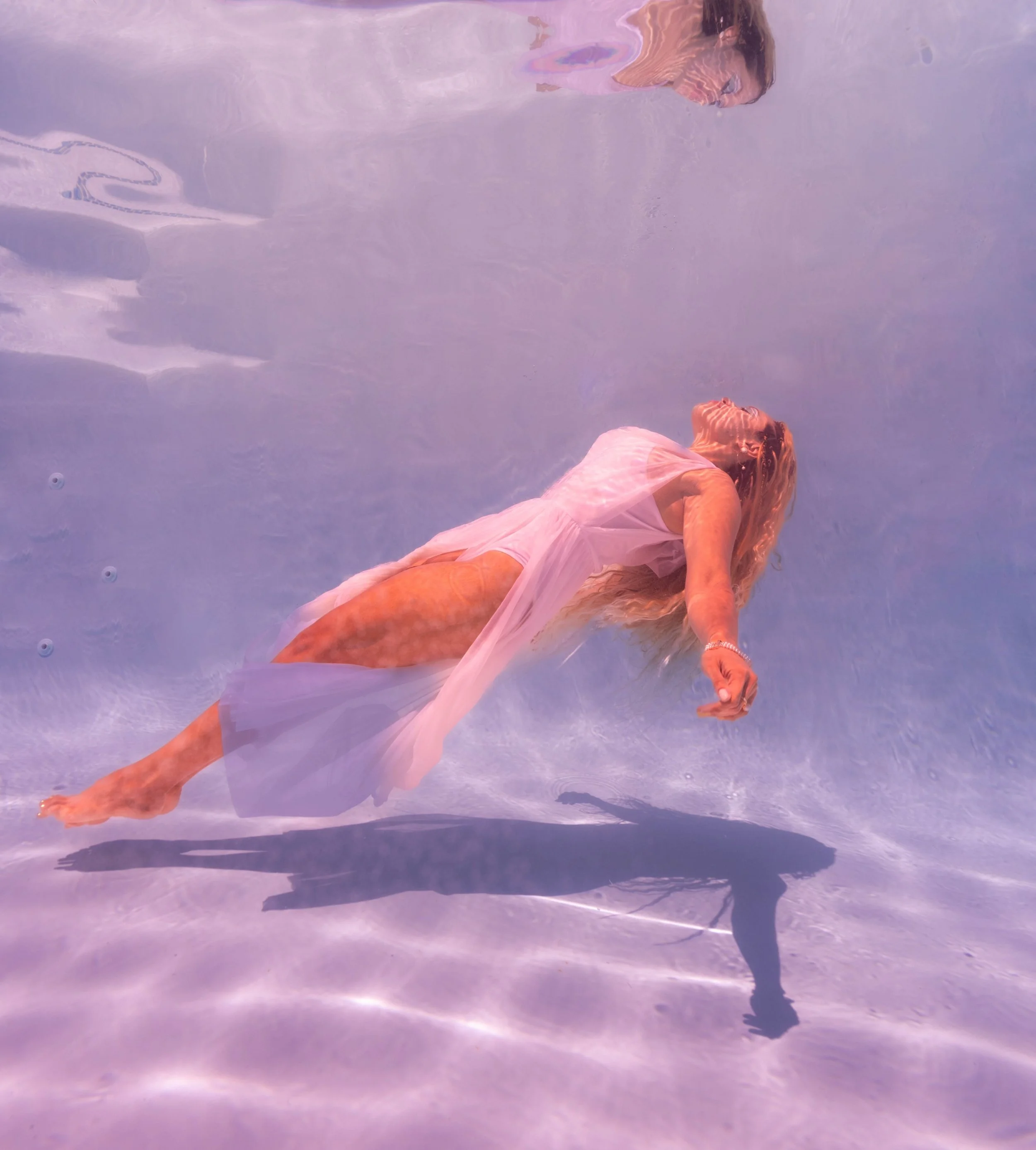 She is weightless 
She is incandescent 
She is transcending time &amp; space with her luminous grace 💫 

Which photo do you like better? 📸 

I had the honor to capture the brilliant @havethumbswilltravel recently in the @kauai.mermaid.experience po