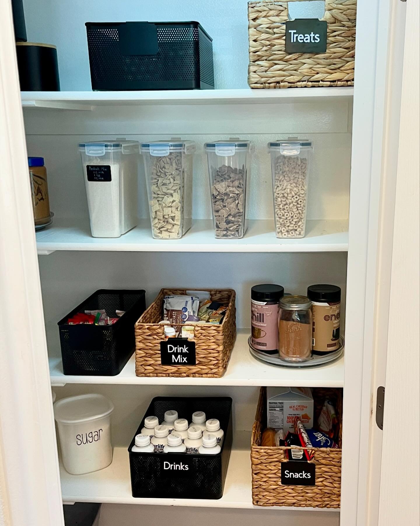 Rid yourself of busy eye-catching packaging and place food items into a canister or bagged-in basket. Take a deep dive into your pantry and throw away expired foods. This client was wonderful to work with! She was already organized but needed those f