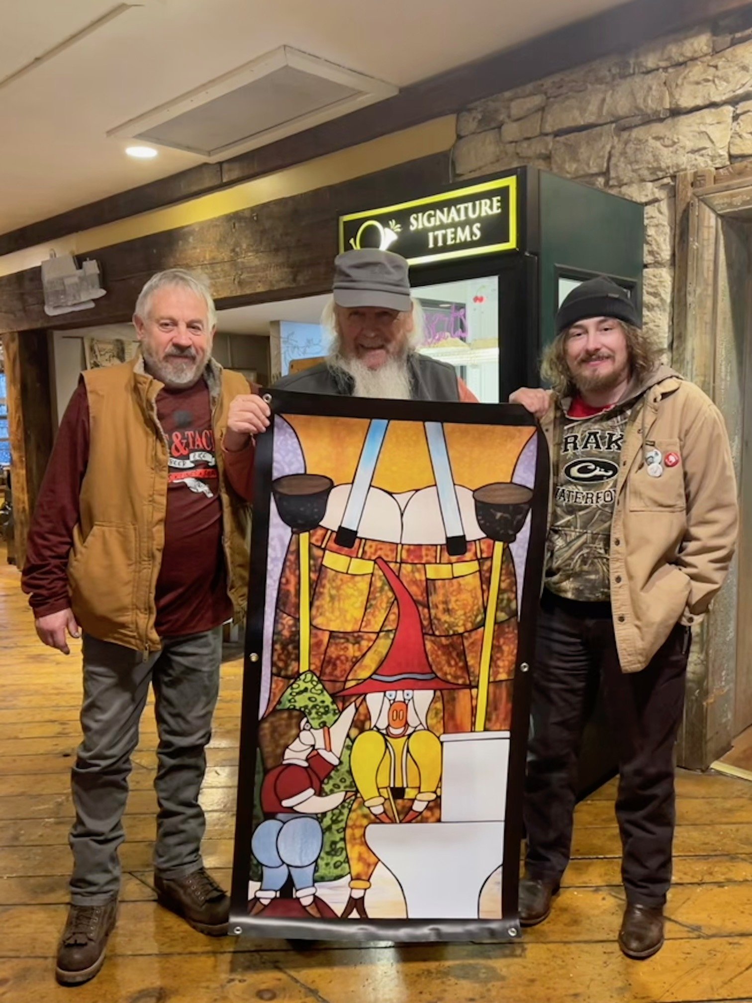 Barry Haver presents his piece called "Toilet Wizard," to Coltt who wrote the song, and his father, the real Toilet Wizard.