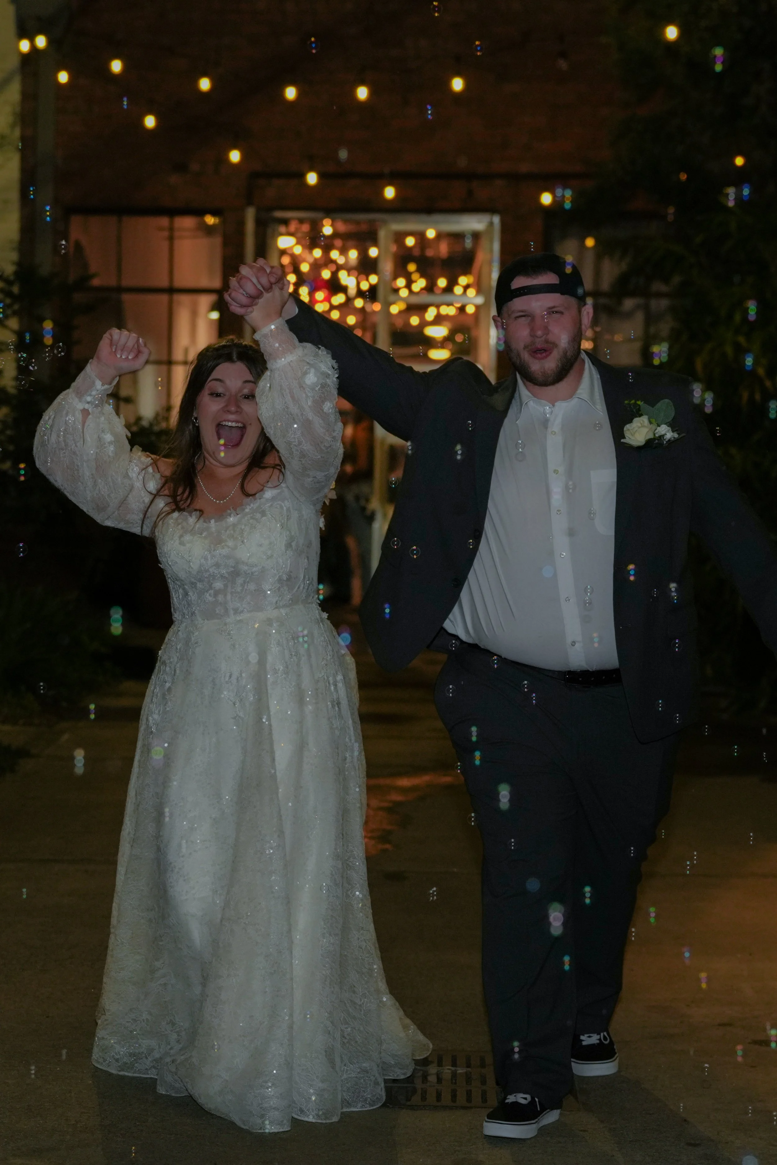 Couple laughing while leaving wedding ceremony captured professionally
