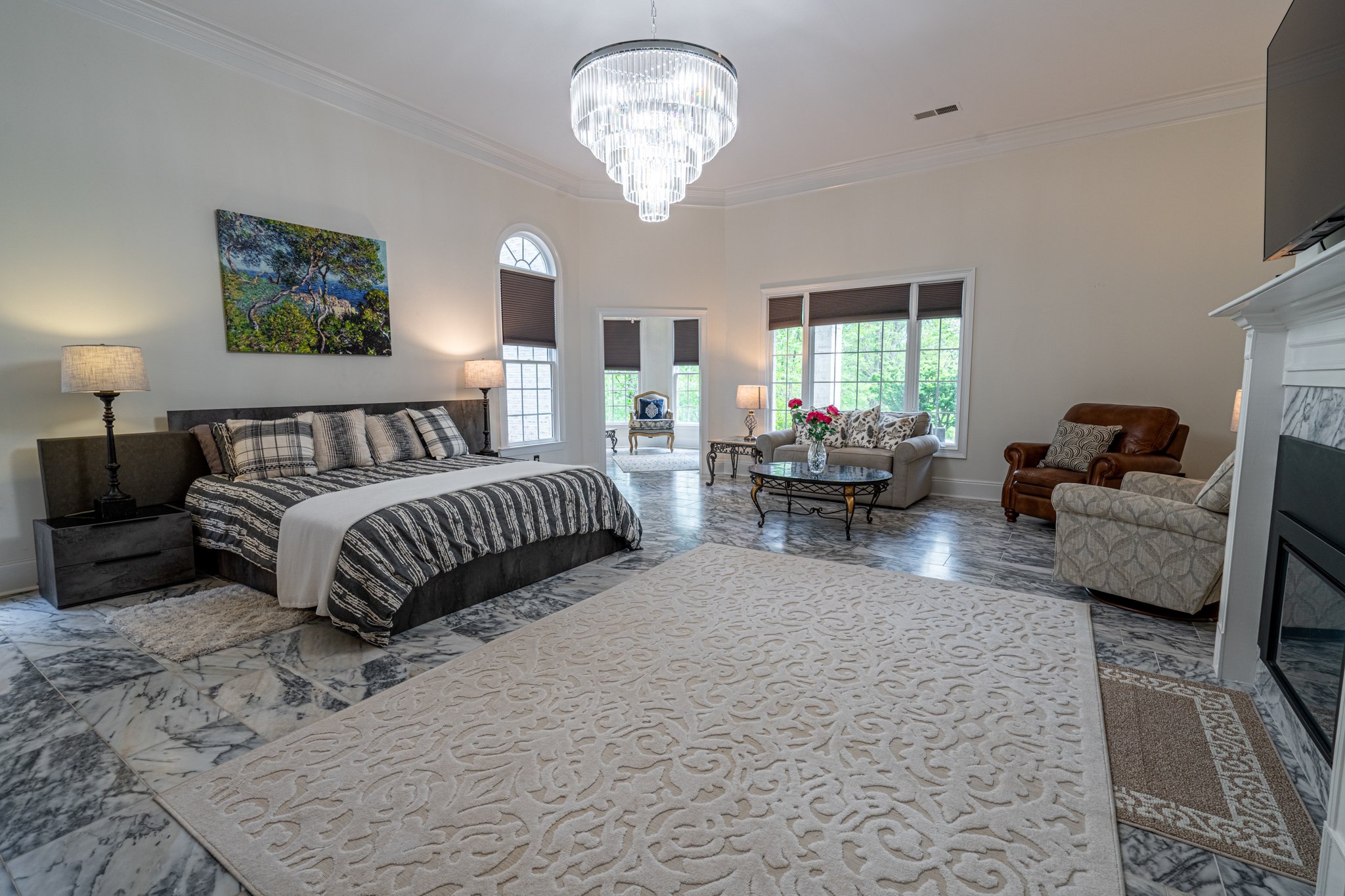 Luxury primary bedroom photographed professionally for high-end real estate marketing in Braselton