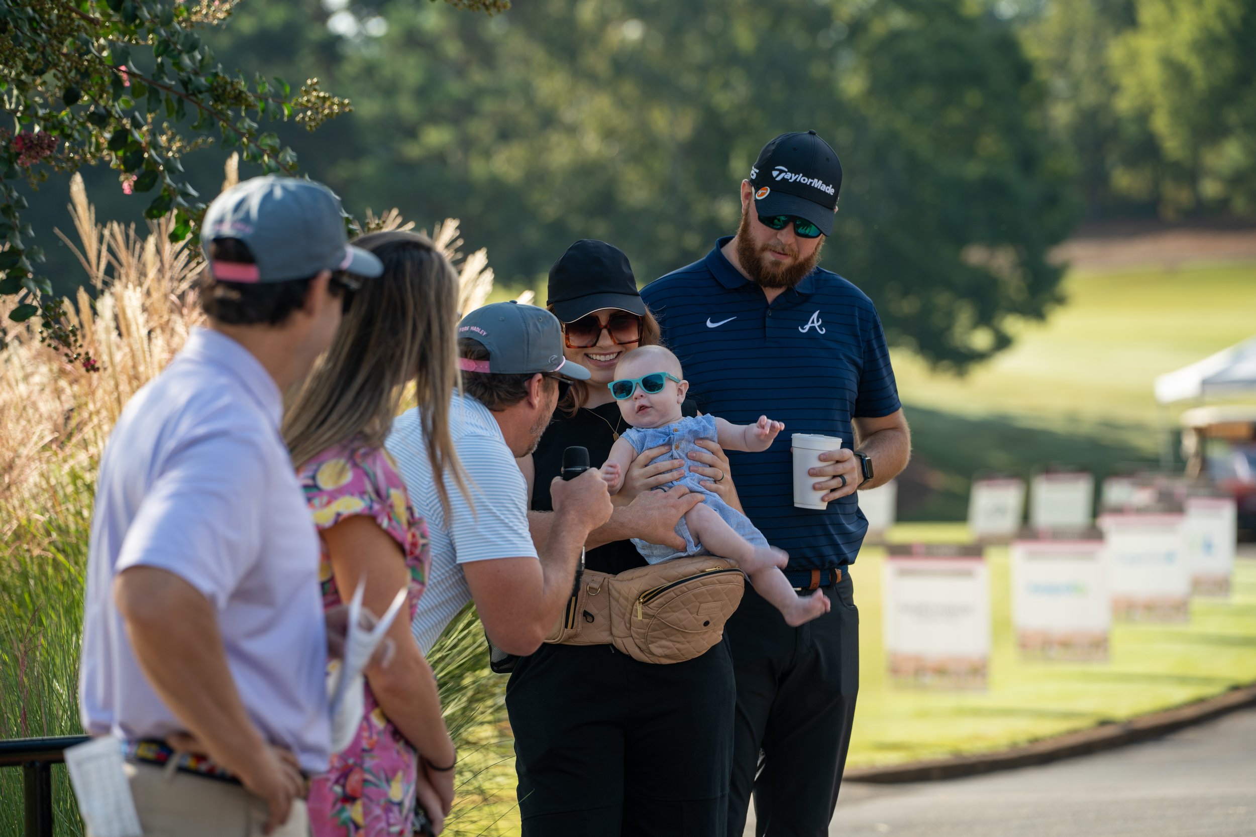 Professional golf event with players and tournament setup