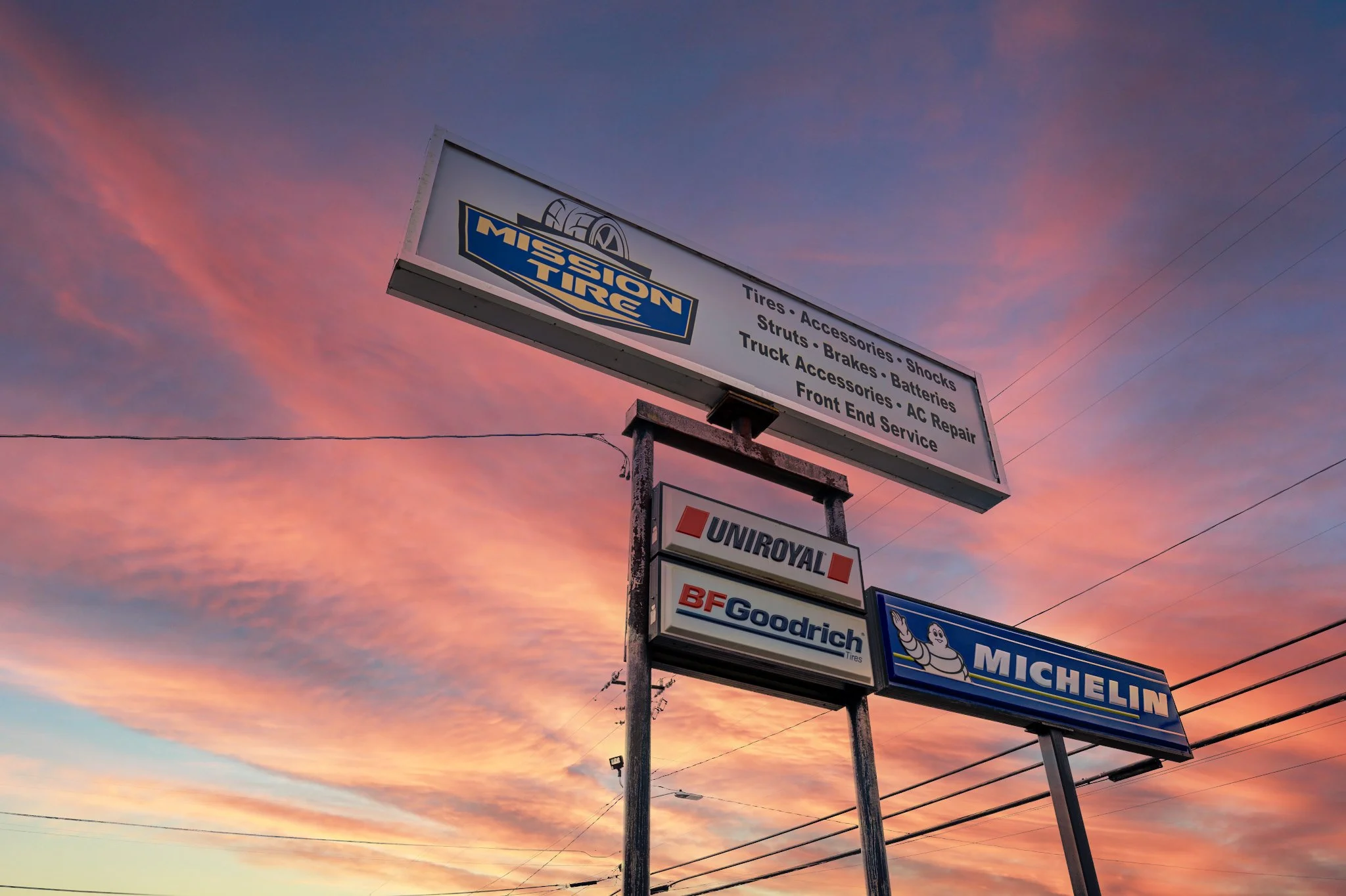 Exterior of professional mechanic shop with service bays and signage