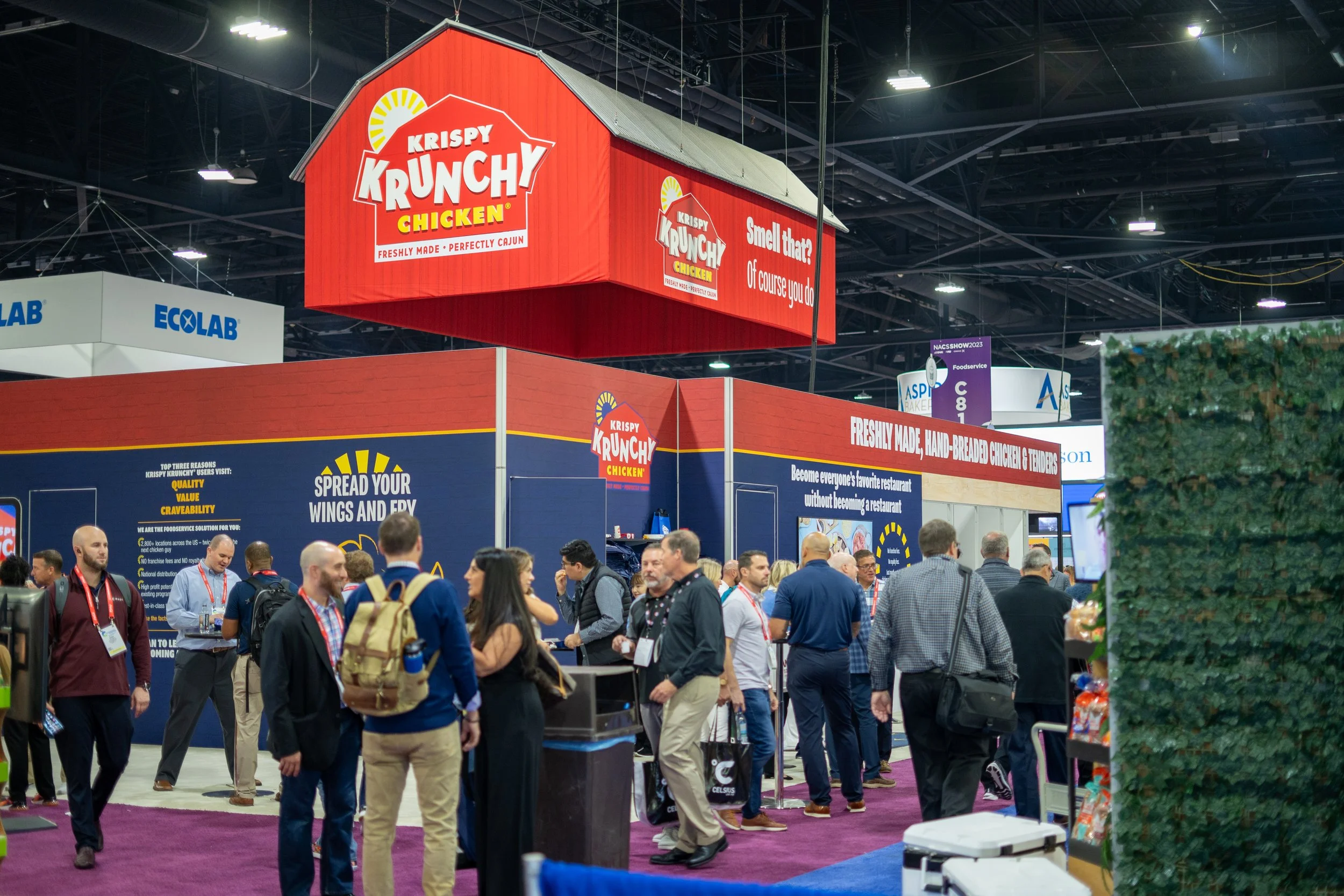 NACS booth at trade show featuring product displays and branding