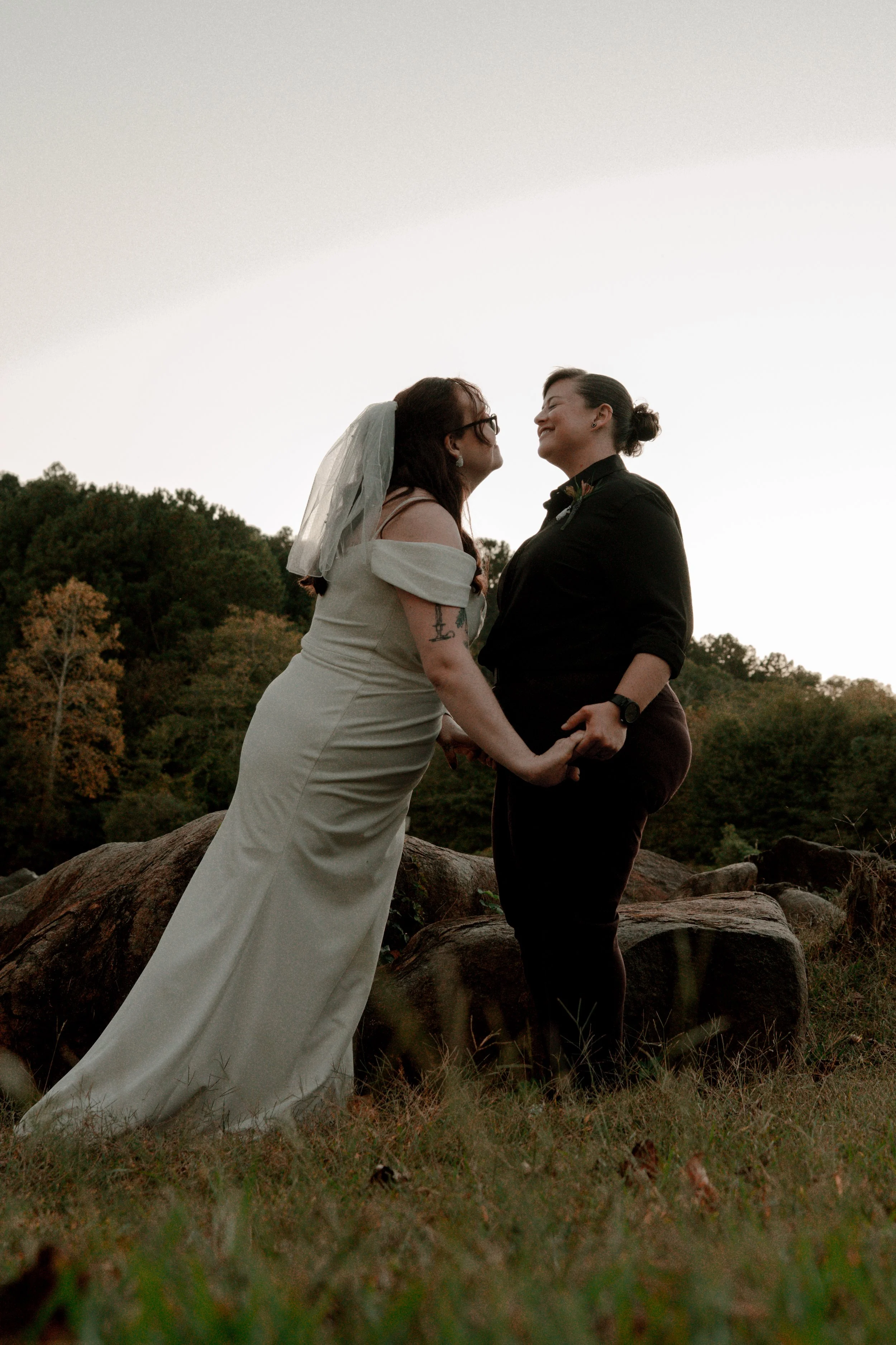 Same-sex couple embracing during wedding portrait session in North GA
