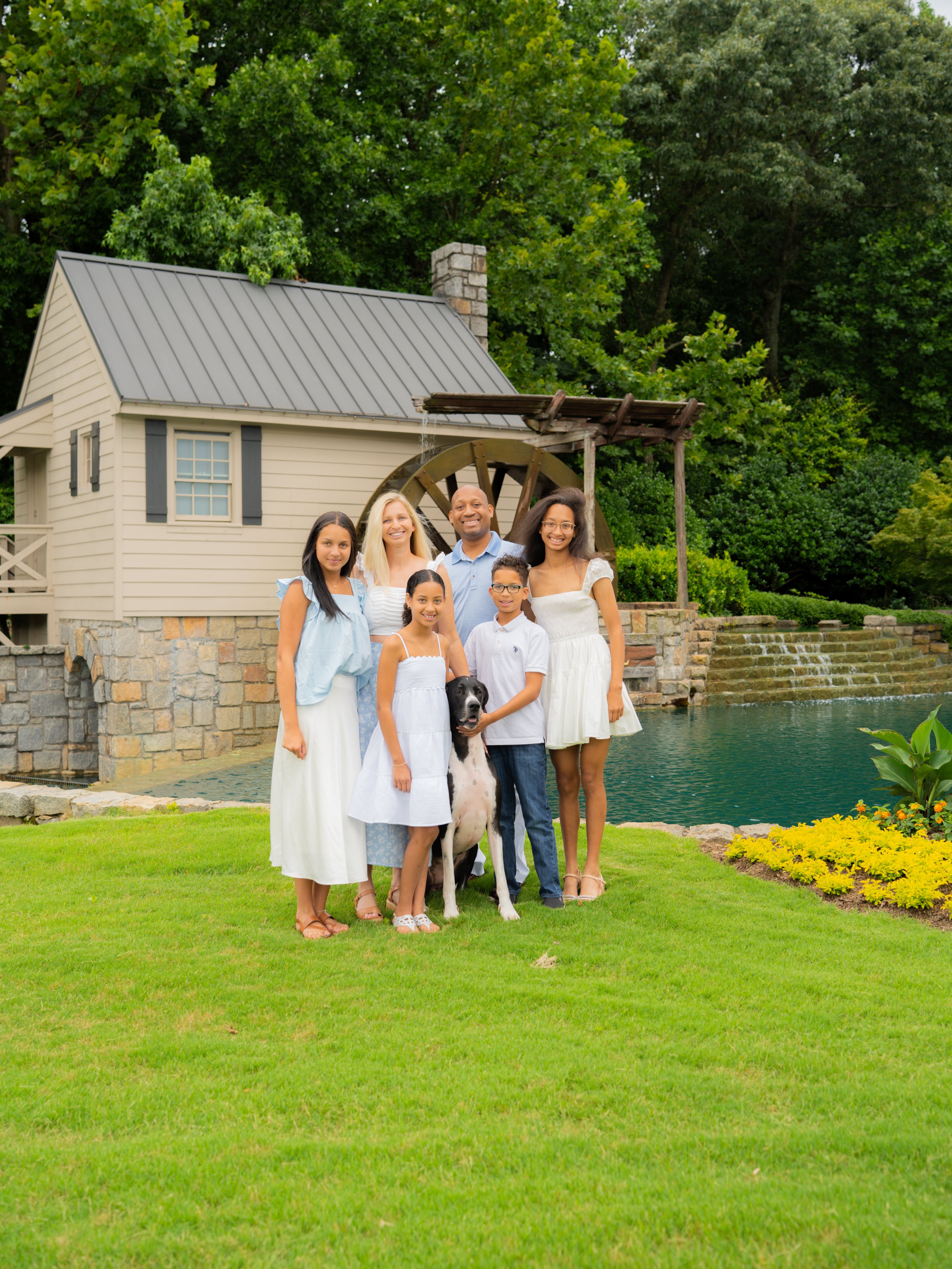 Professional family portrait with smiling parents and children in Buford GA