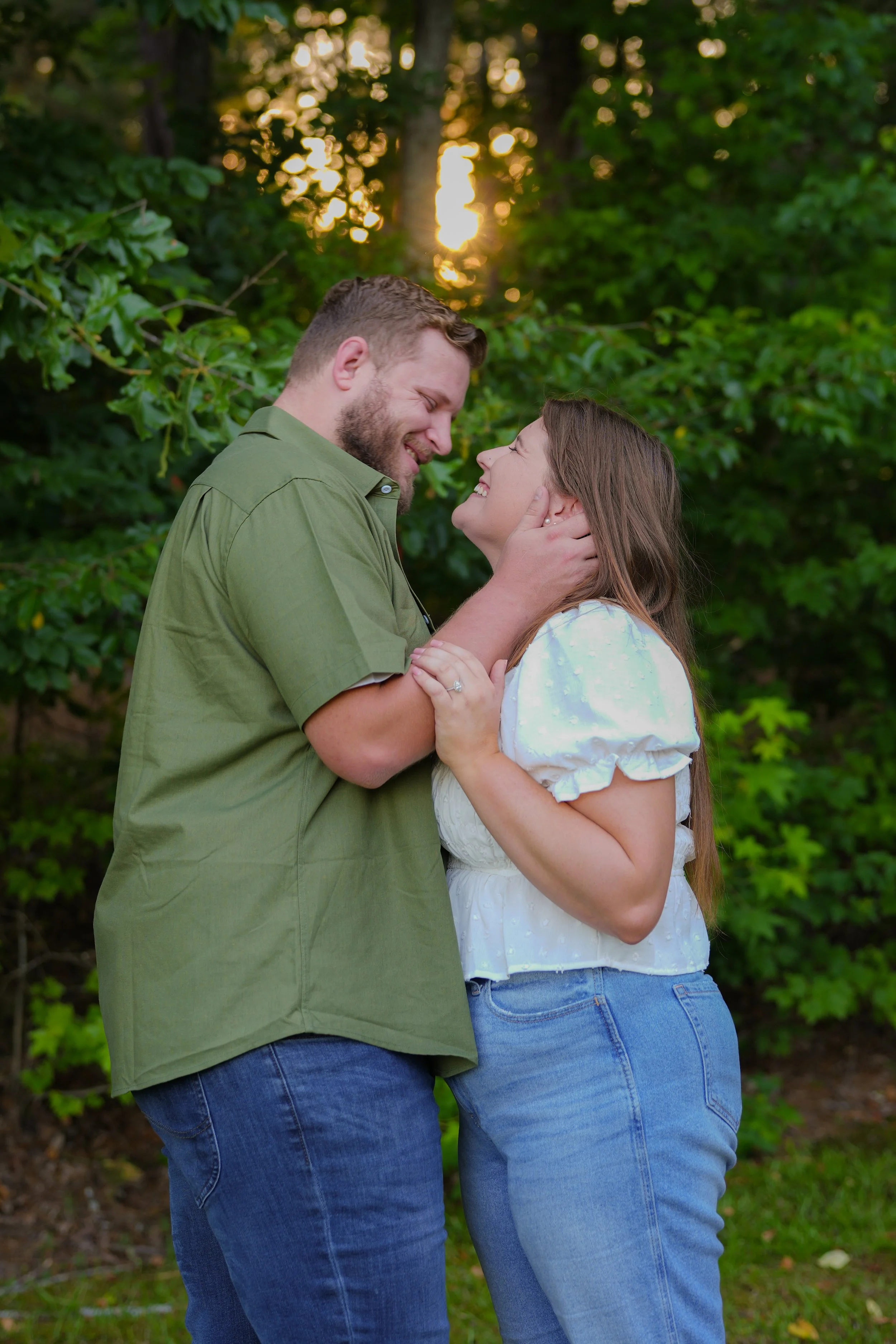 Couple embracing during engagement-style portrait session in Buford GA