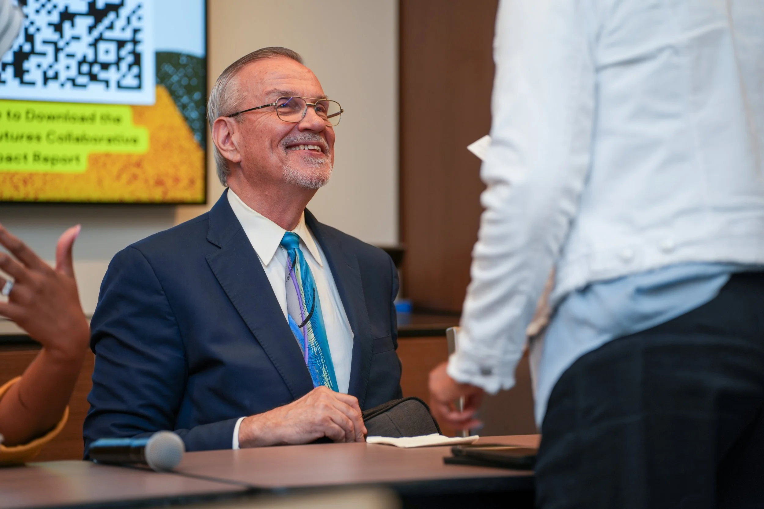 Event speaker presenting to audience at business conference