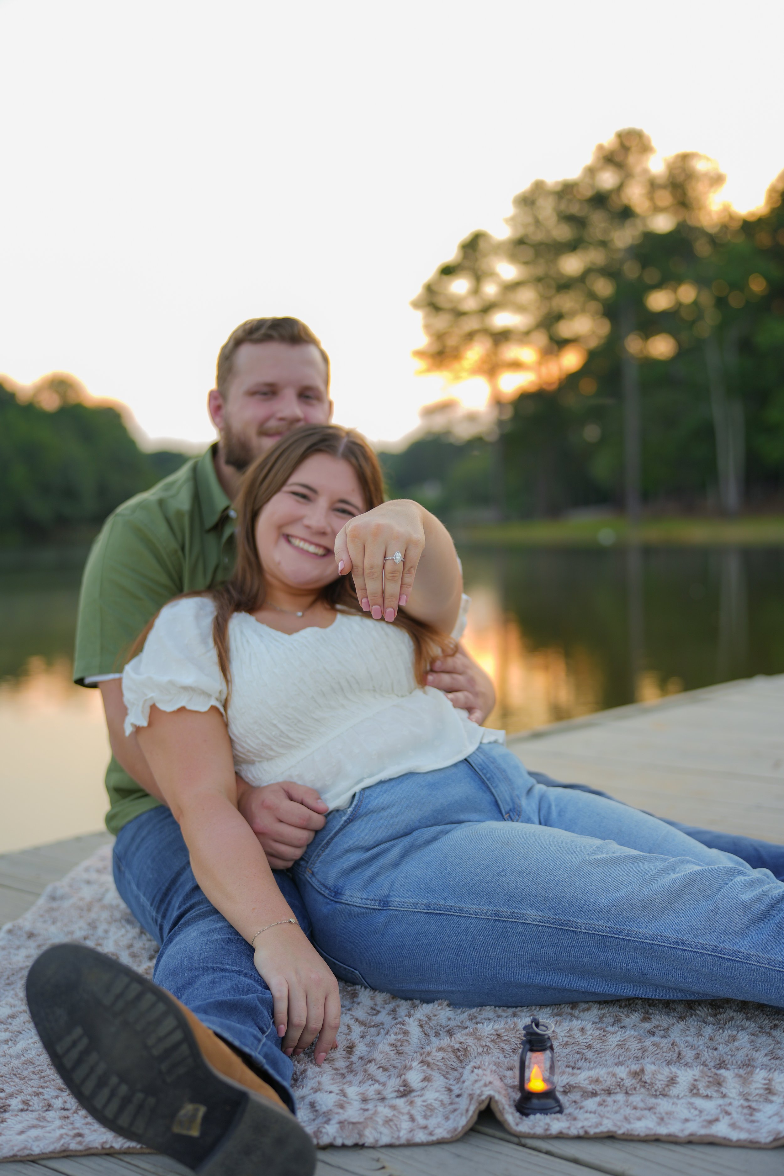 Engagement ring and couple hands photographed during portrait session