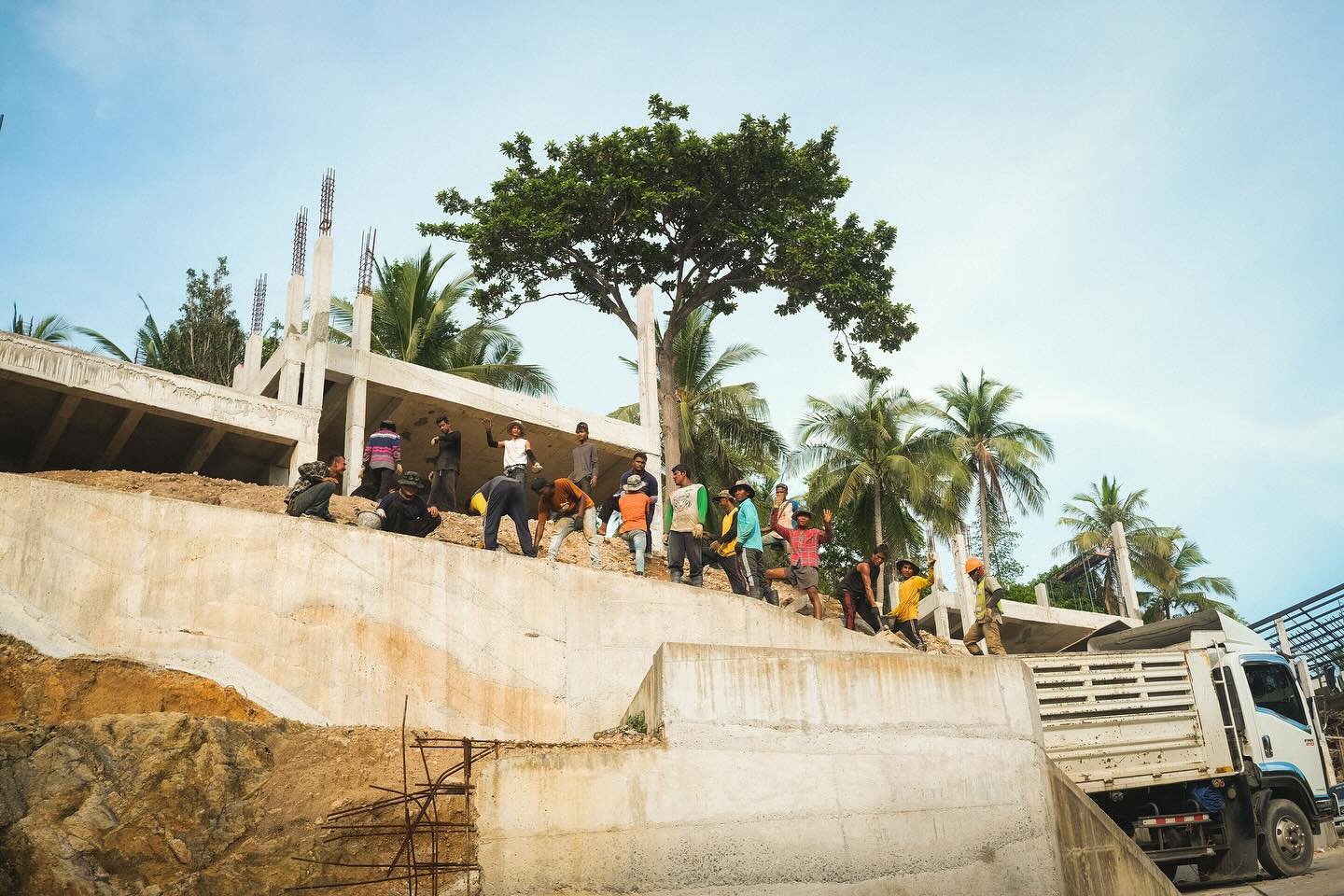 Flow state; the men were in construction, passing buckets of water? Concrete? down the chain. I had only seen them briefly as I was on my scooter, but pulled over immediately for the photograph. Some noticed and waved for me, and then a few shot thei