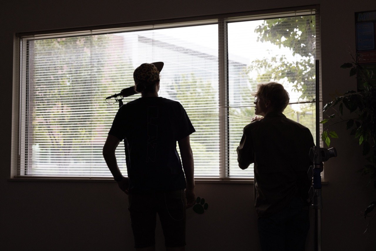 Boom Operator and Key Grip discuss the oncoming wind storm.