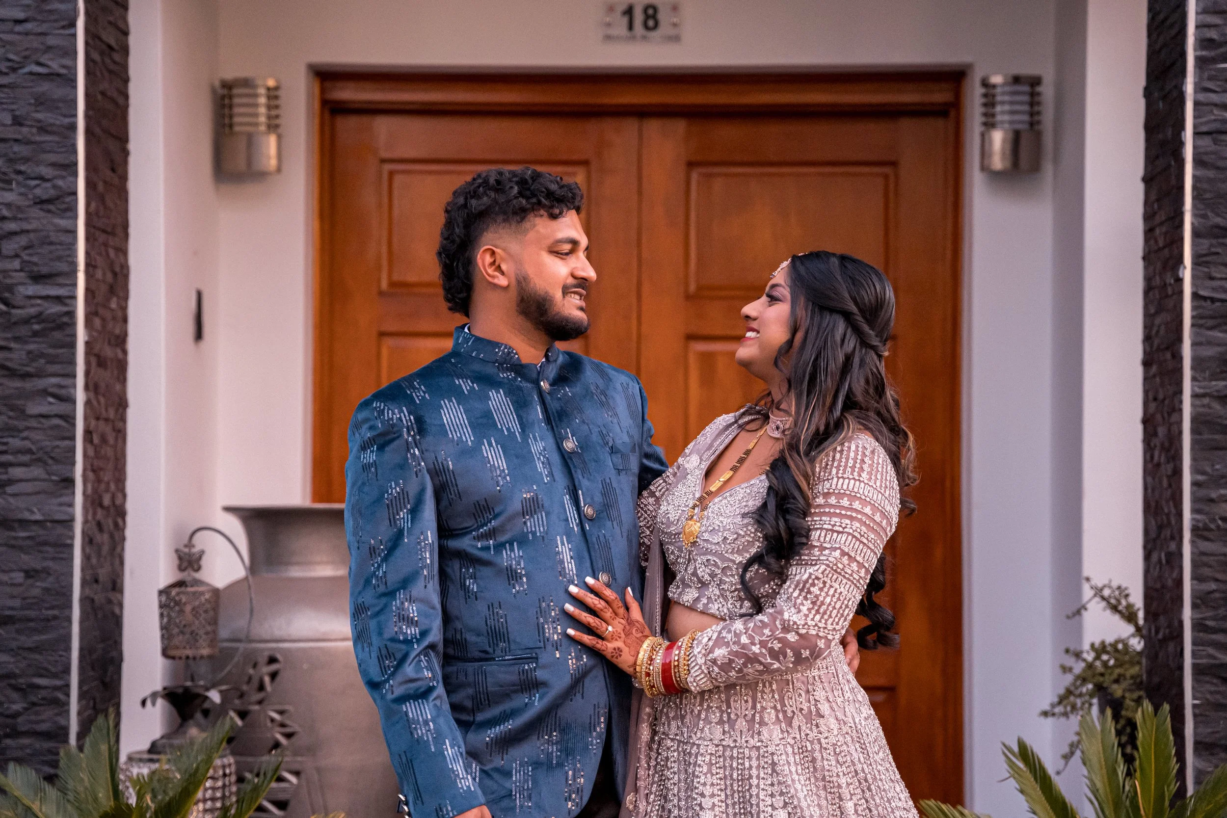 Couple in traditional Indian attire sharing a candid smile - Sydney engagement photography