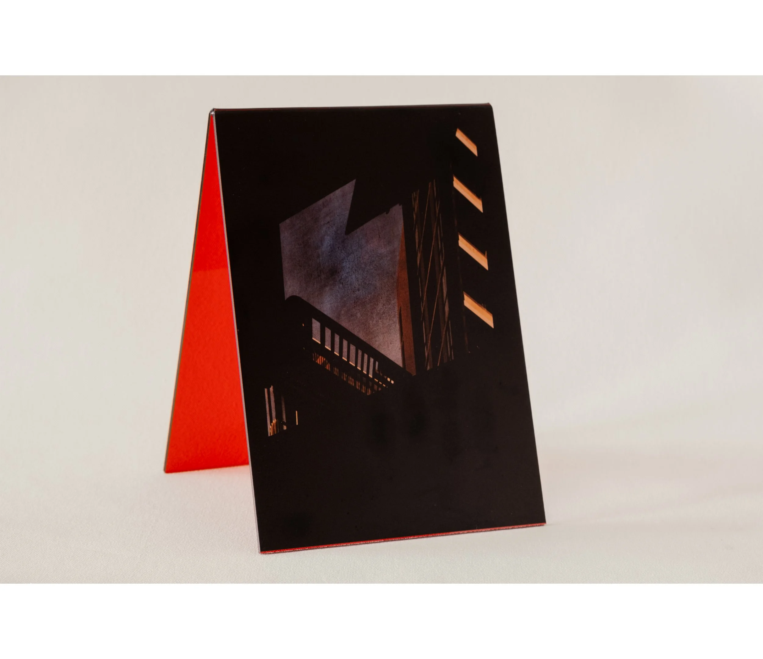 Token #4, 2024, UV print on red tint acrylic folded A-frame, 14.8 x 21.0cm