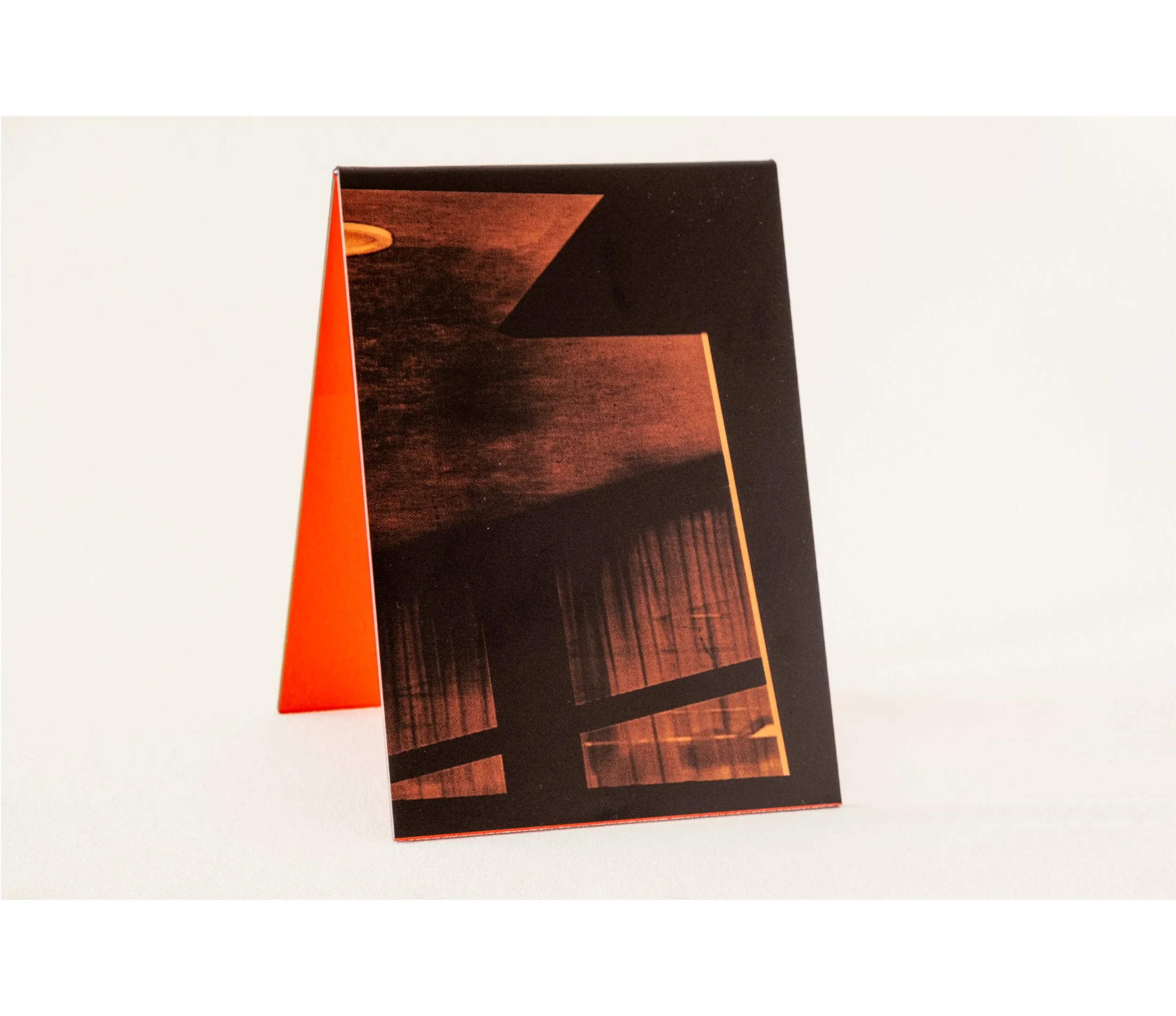 Token #2, 2024, UV print on red tint acrylic folded A-frame, 14.8 x 21.0cm