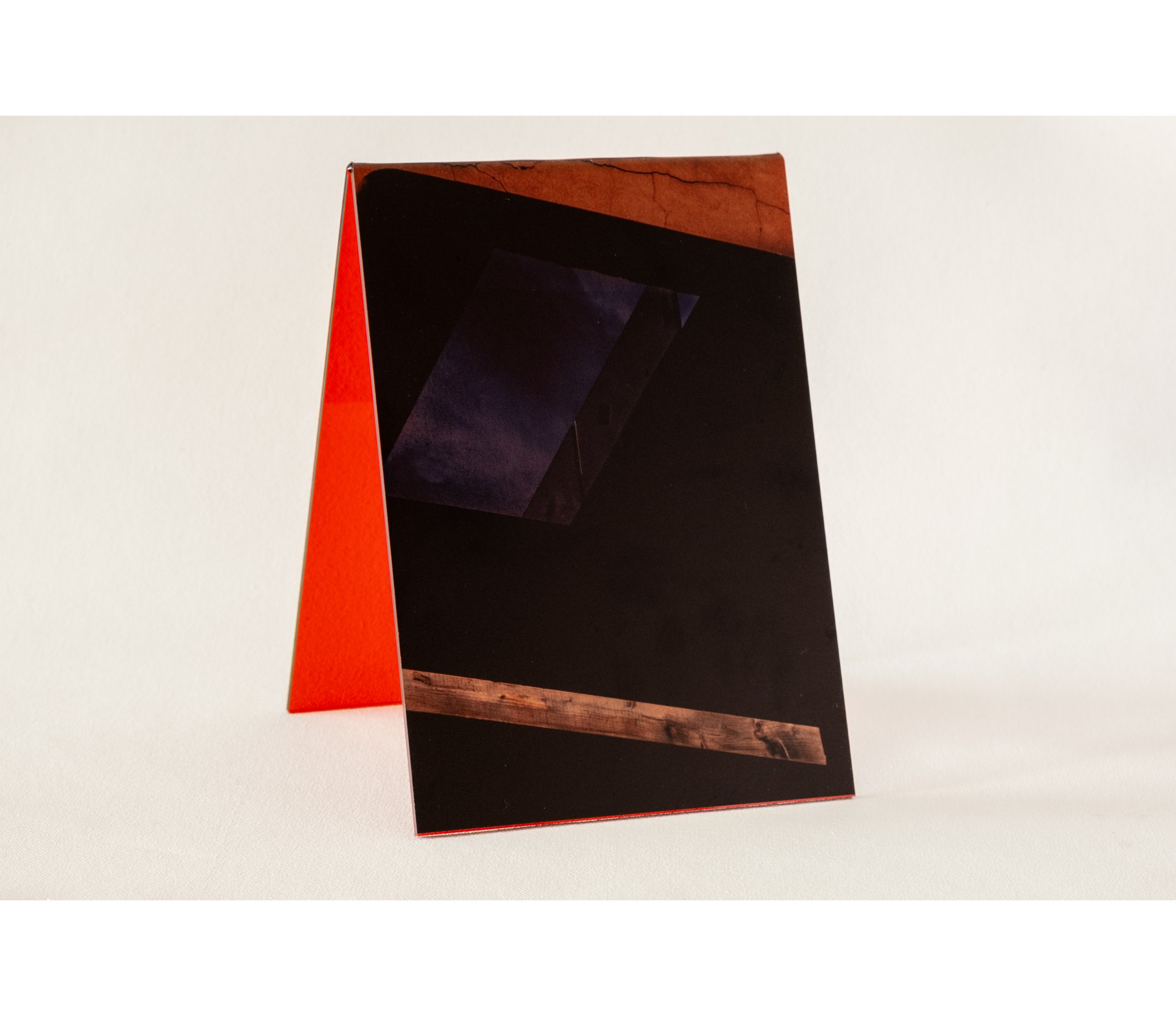 Token #5, 2024, UV print on red tint acrylic folded A-frame, 14.8 x 21.0cm