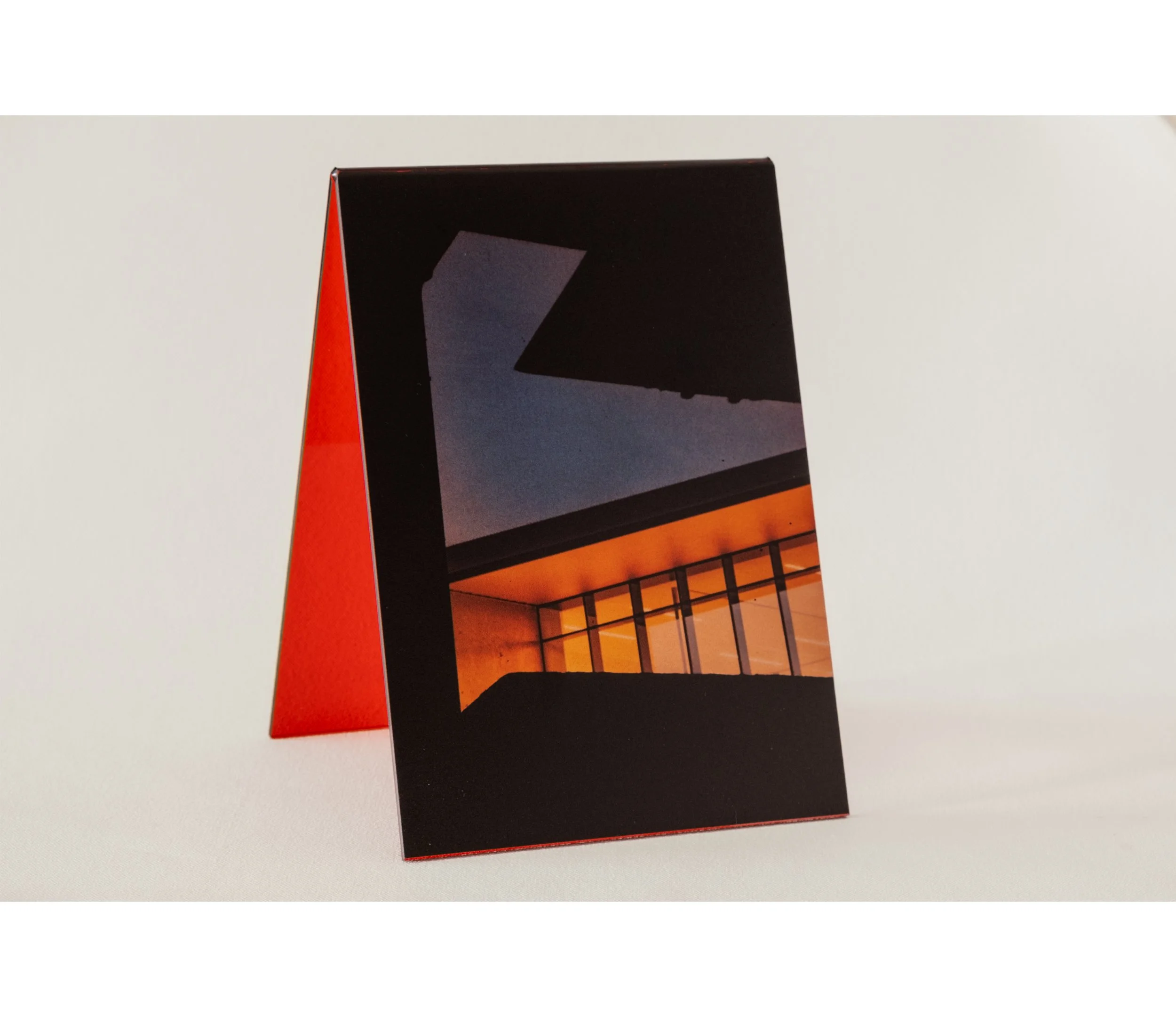 Token #3, 2024, UV print on red tint acrylic folded A-frame, 14.8 x 21.0cm