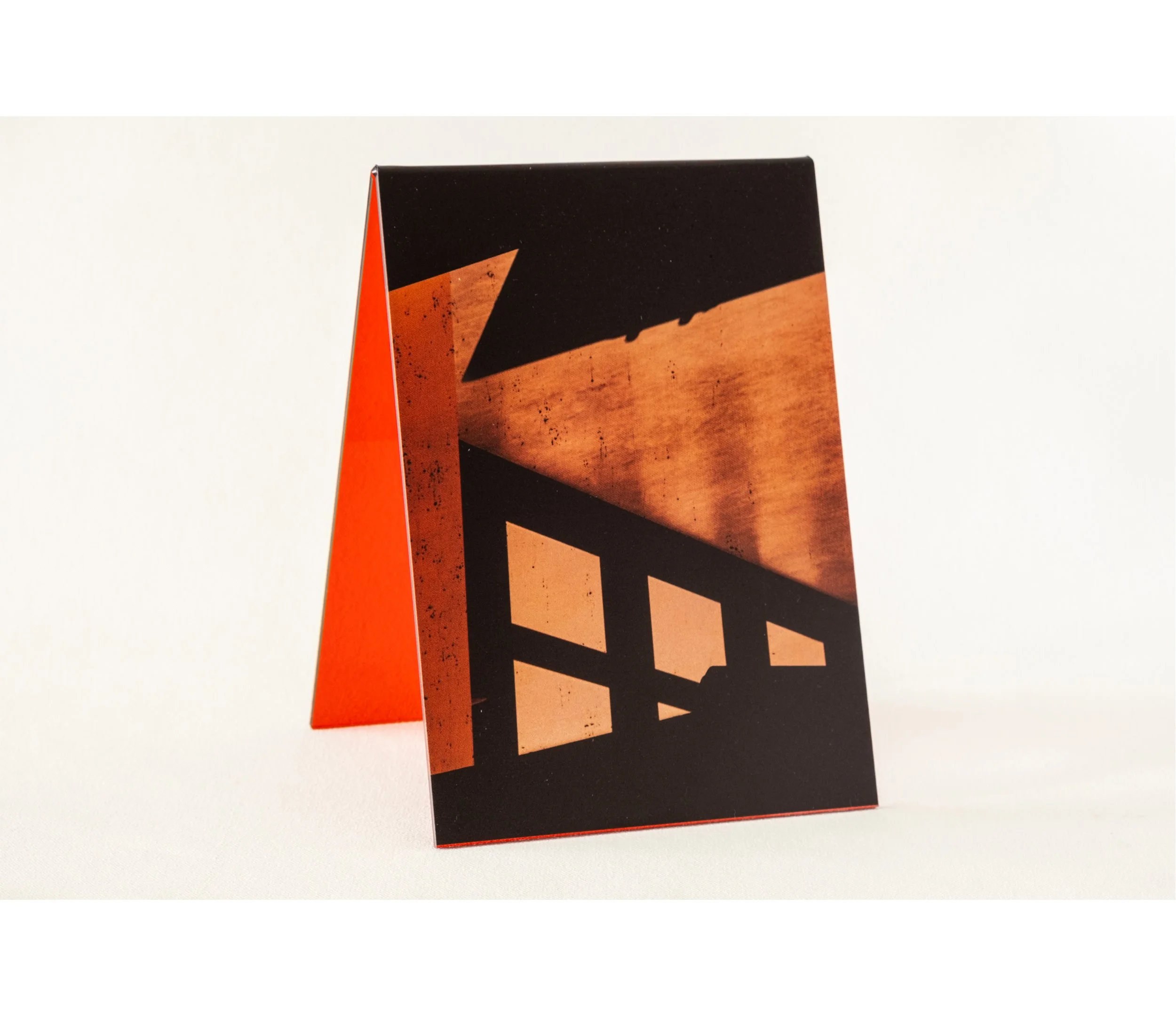 Token #1, 2024, UV print on red tint acrylic folded A-frame, 14.8 x 21.0cm