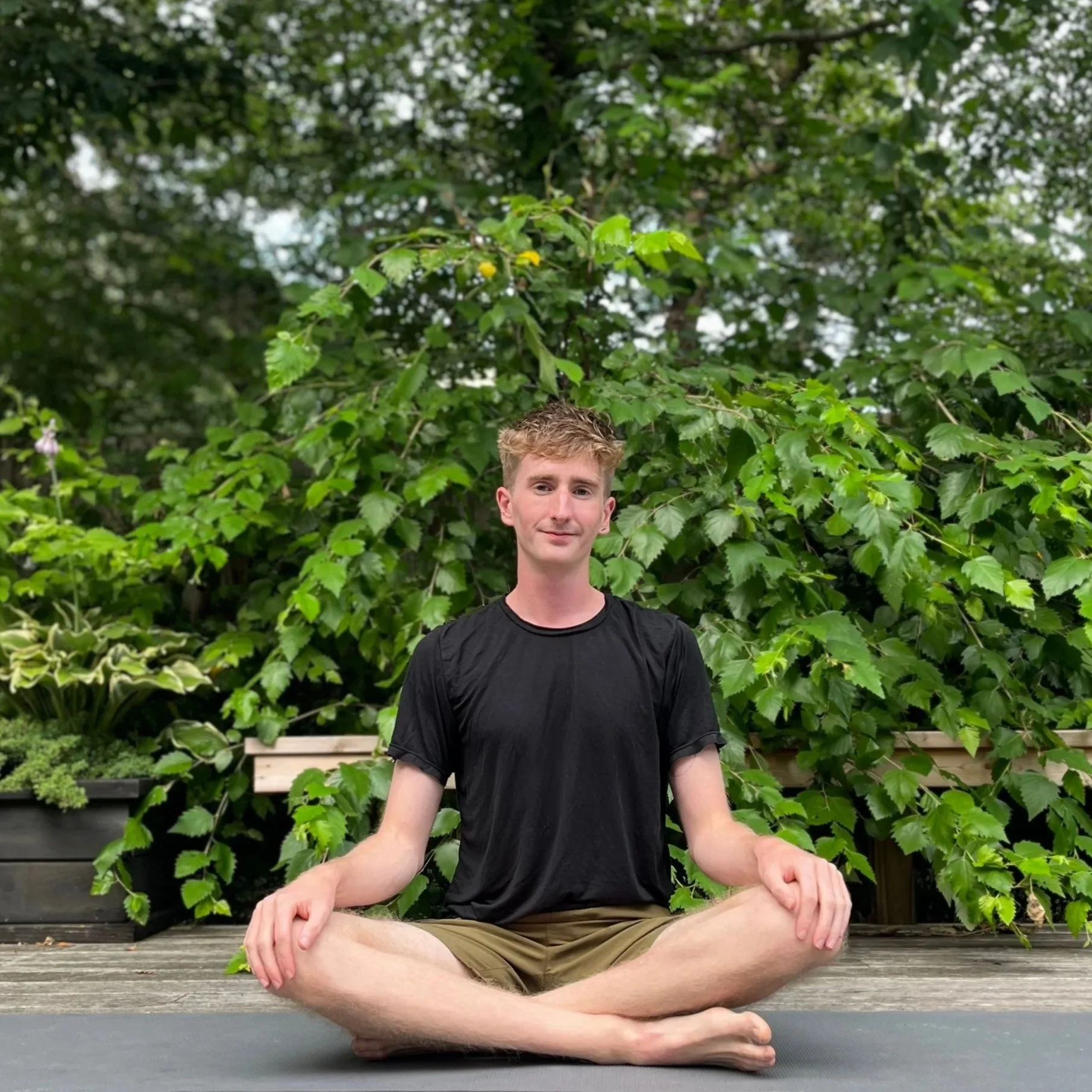 NYC private yoga instructor Jimmie Costello, with over 200 hours of training and 100+ private classes taught, offering anatomy-informed movement for men.