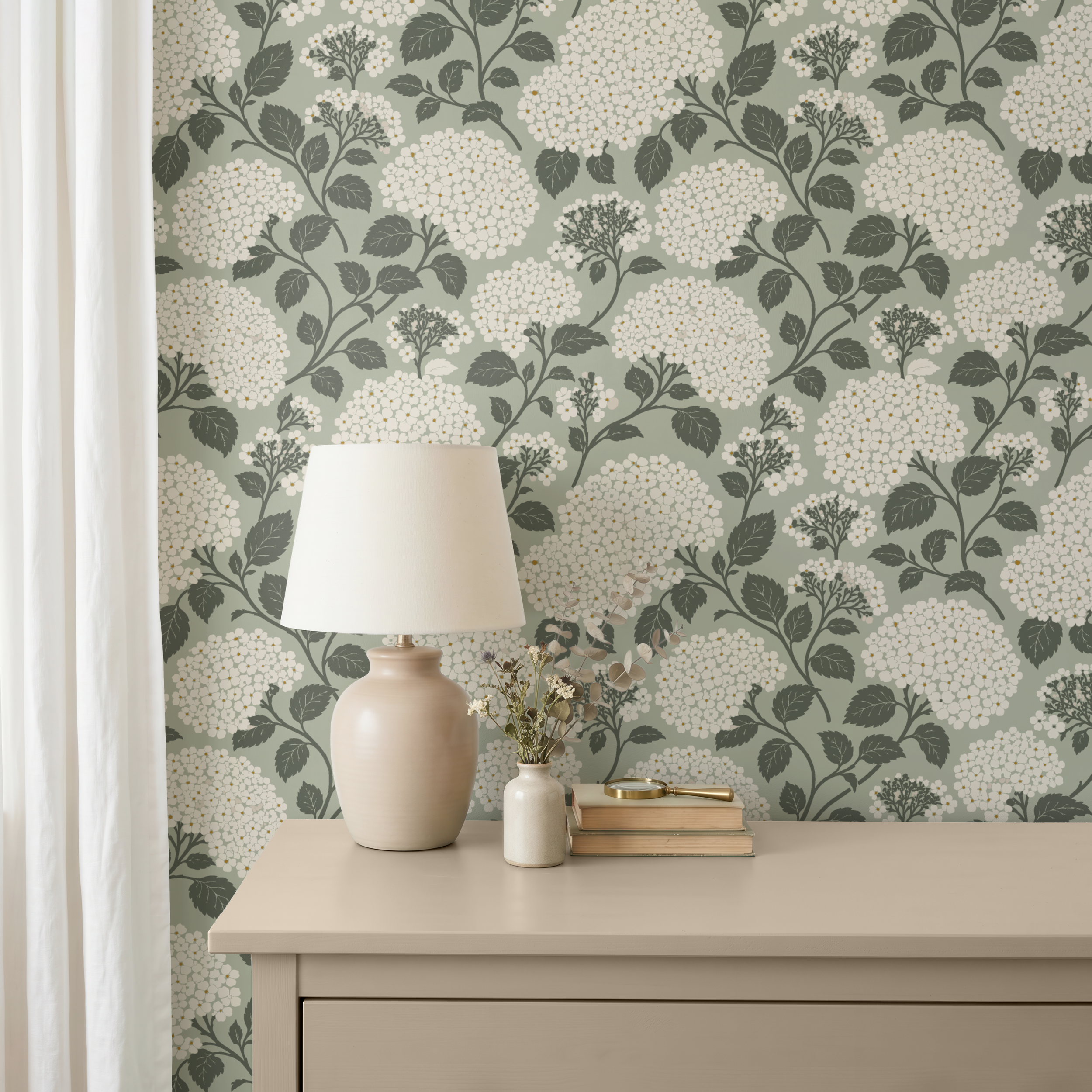 Sage green hydrangea wallpaper shown in an elegant interior setting.