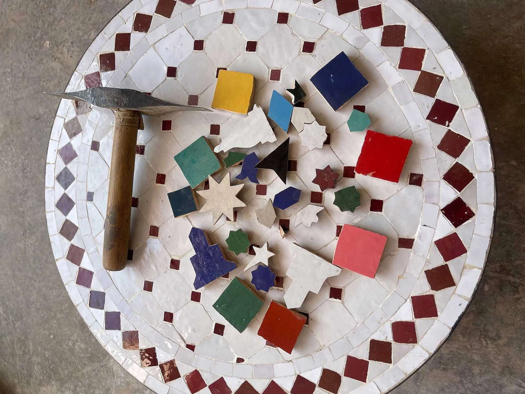 Ornate Islamic architectural details with intricate carvings and sunlight shining over the top.