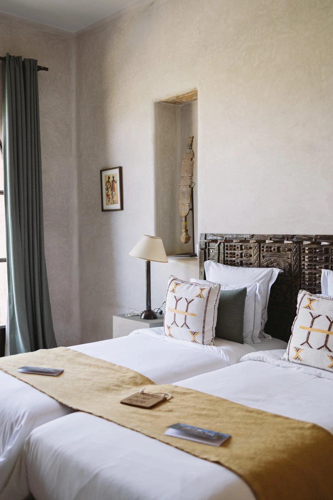 Outdoor dining table with blue plates, tagines, and various dishes