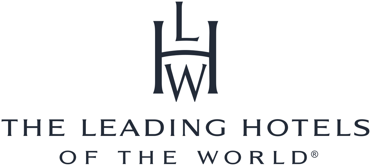 Logo for The Leading Hotels of the World, featuring an abstract stylized crest with the initials 'LHW' and the text 'THE LEADING HOTELS OF THE WORLD' beneath it.