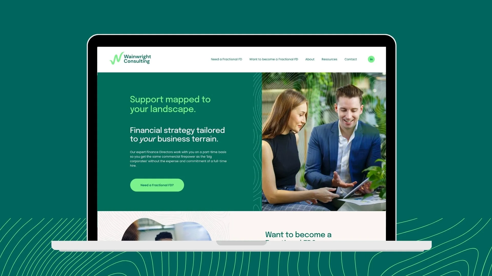 Wainwright Consulting fractional finance director website displayed on a laptop, featuring two business professionals and financial strategy messaging