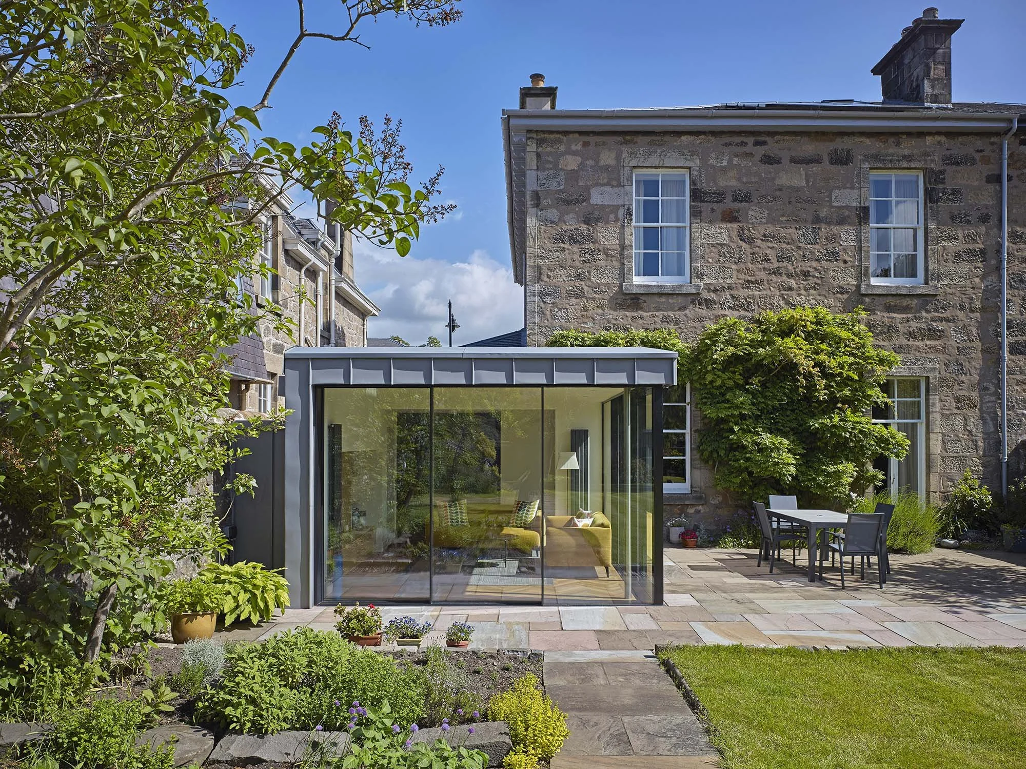 Glass extension to listed home in Conservation Area