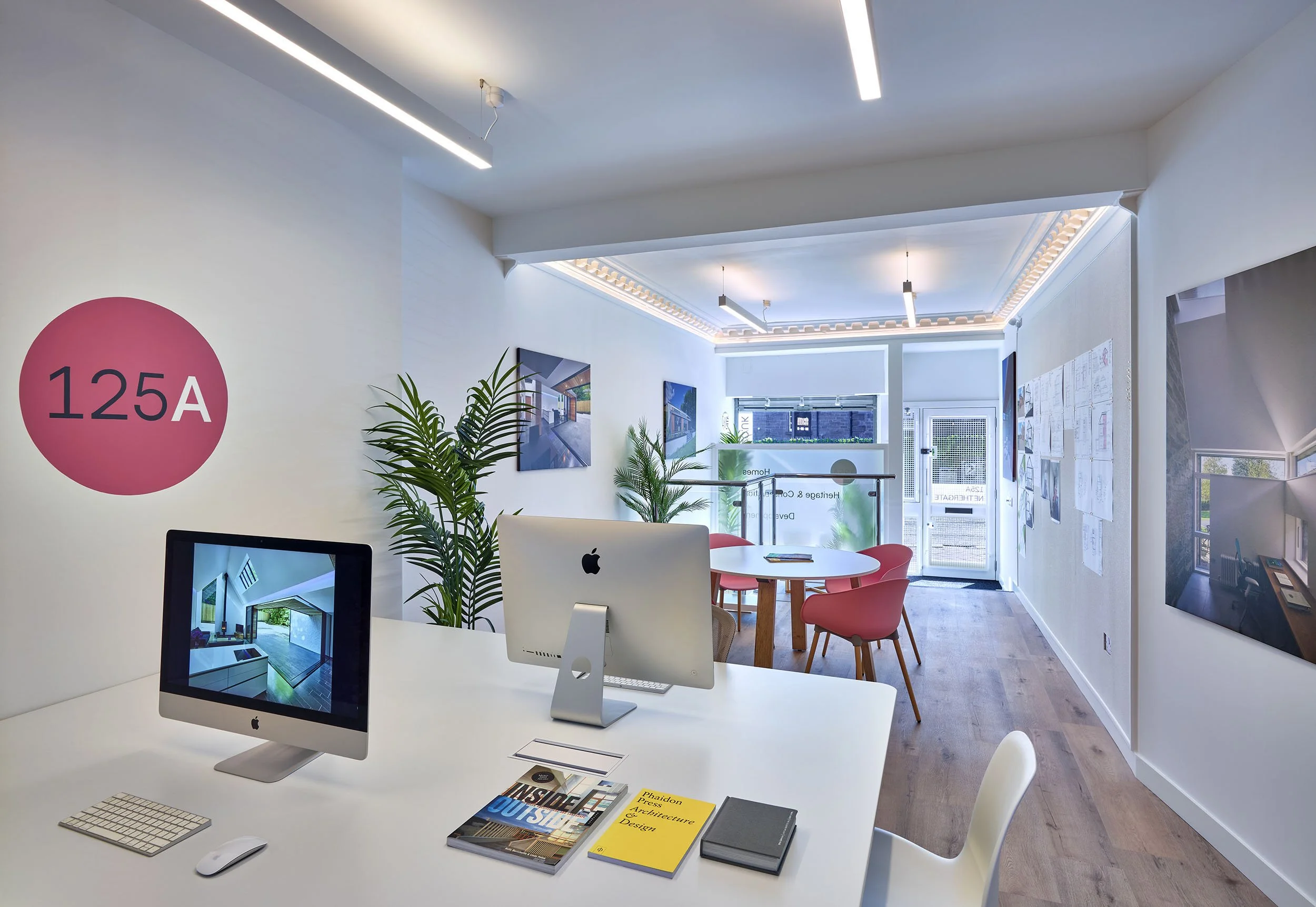 Interior of 125A Nethergate, showing the 125Architects studio with desks, project photographs, drawings and the 125A wall logo.