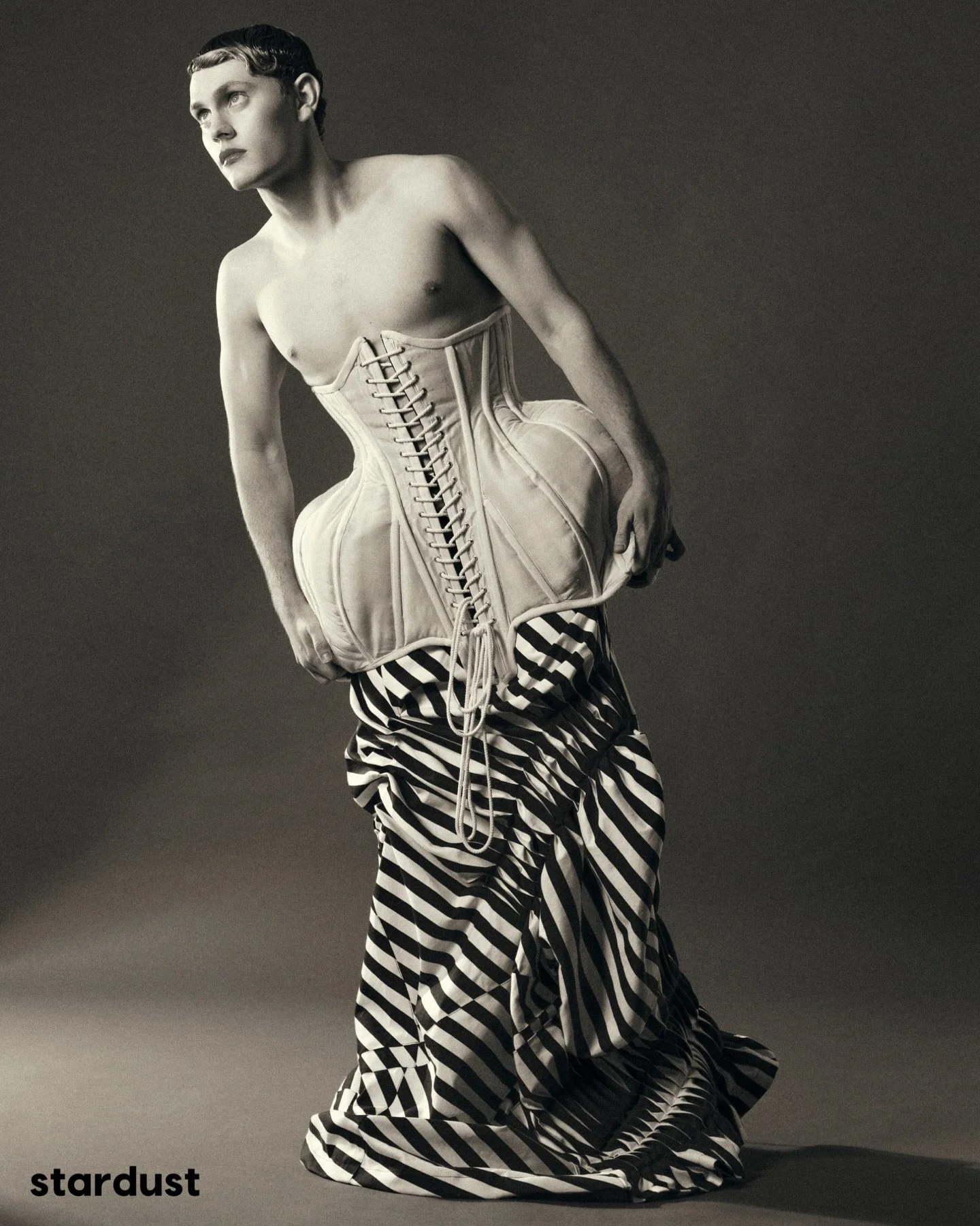 The series features the model Nico styled in garments traditionally coded as feminine, paired with soft makeup and a refined, minimal aesthetic. The images focus on silhouette, texture, and composition, allowing the garments to take visual prominence