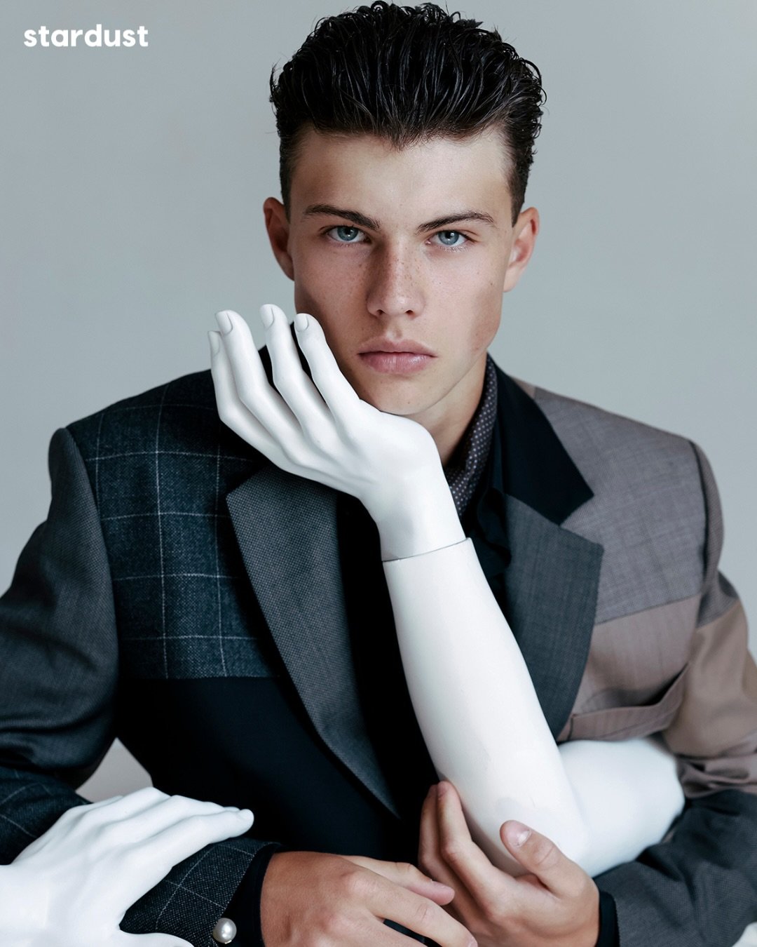 Rooted in a personal, female perspective, this series places male models in tailored suits within a surreal landscape of plastic mannequins and fragmented body parts arranged across a checkerboard floor. By drawing on the polished, composed, and near