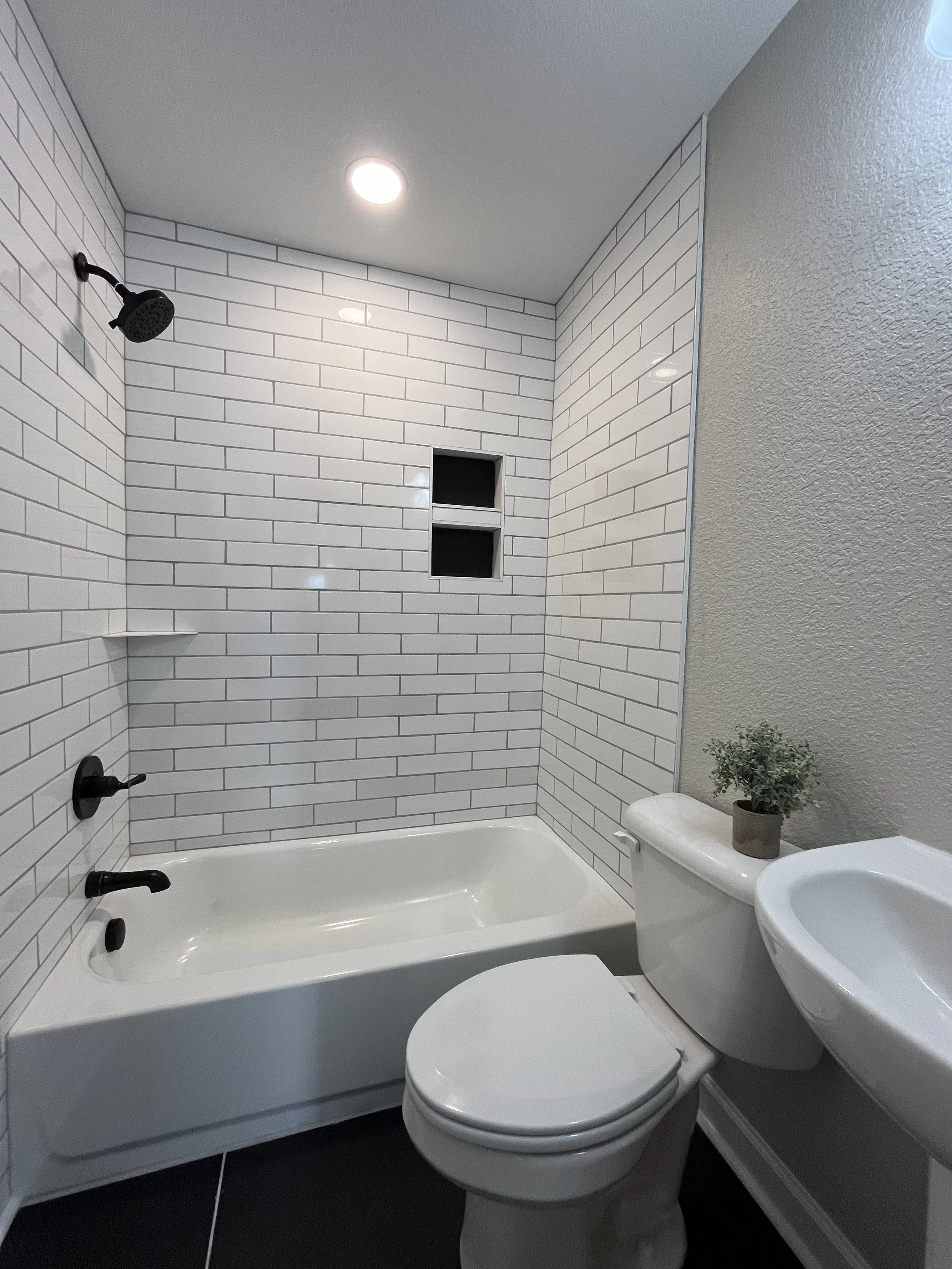 Professional bathroom remodeling and renovation with custom tile, cabinetry, and modern fixtures.Residential bathroom renovation featuring professional tile installation, updated cabinetry, modern plumbing fixtures, and custom layouts.