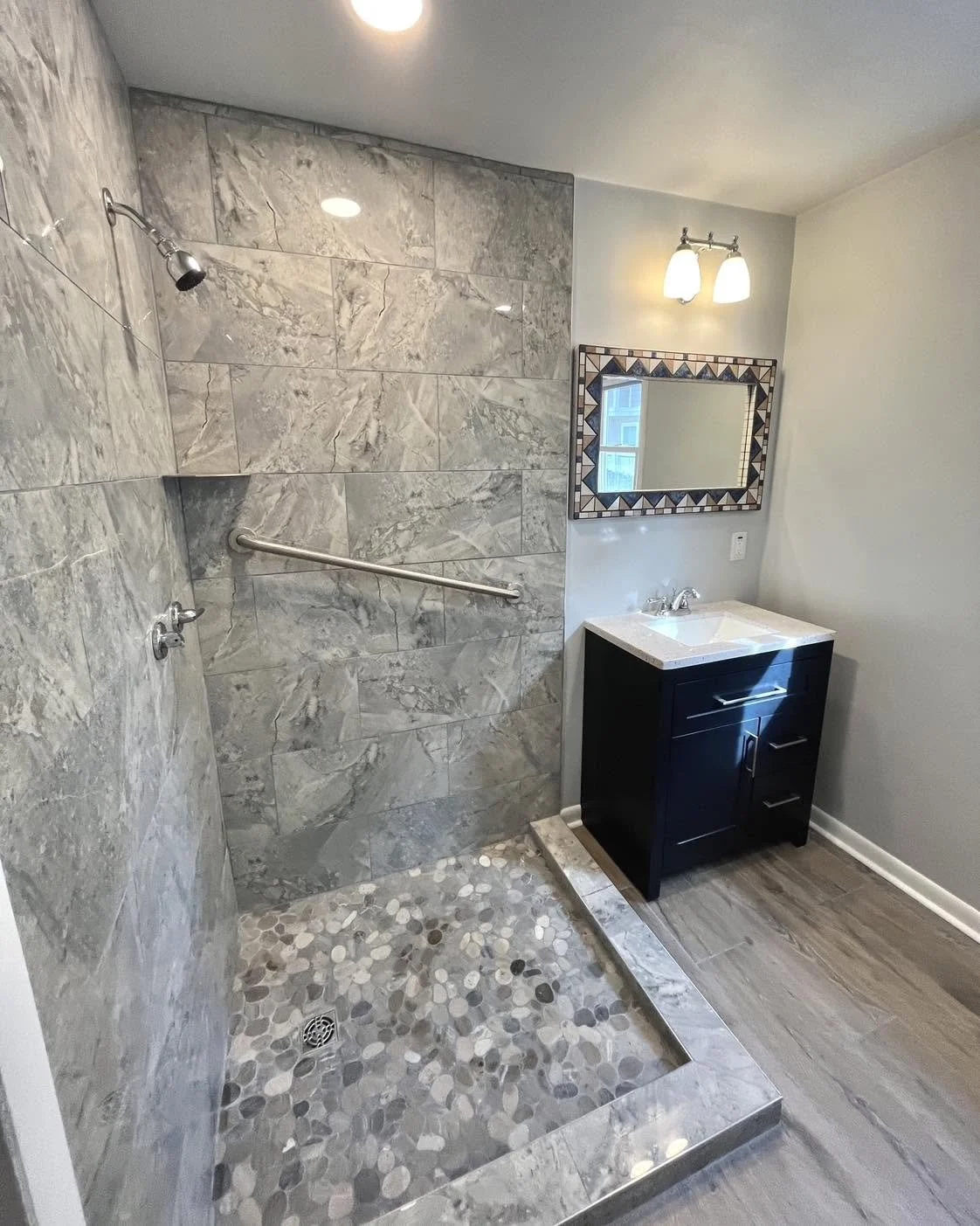 Professional bathroom remodeling and renovation with custom tile, cabinetry, and modern fixtures.Residential bathroom renovation featuring professional tile installation, updated cabinetry, modern plumbing fixtures, and custom layouts.