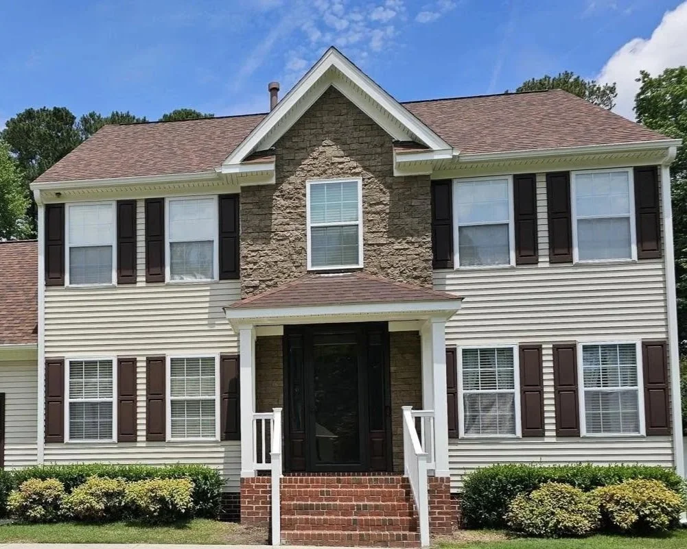 A house with brick/masonry work on the front porch done by Class A contractors local to Portsmouth Virginia and the Hampton Roads area.