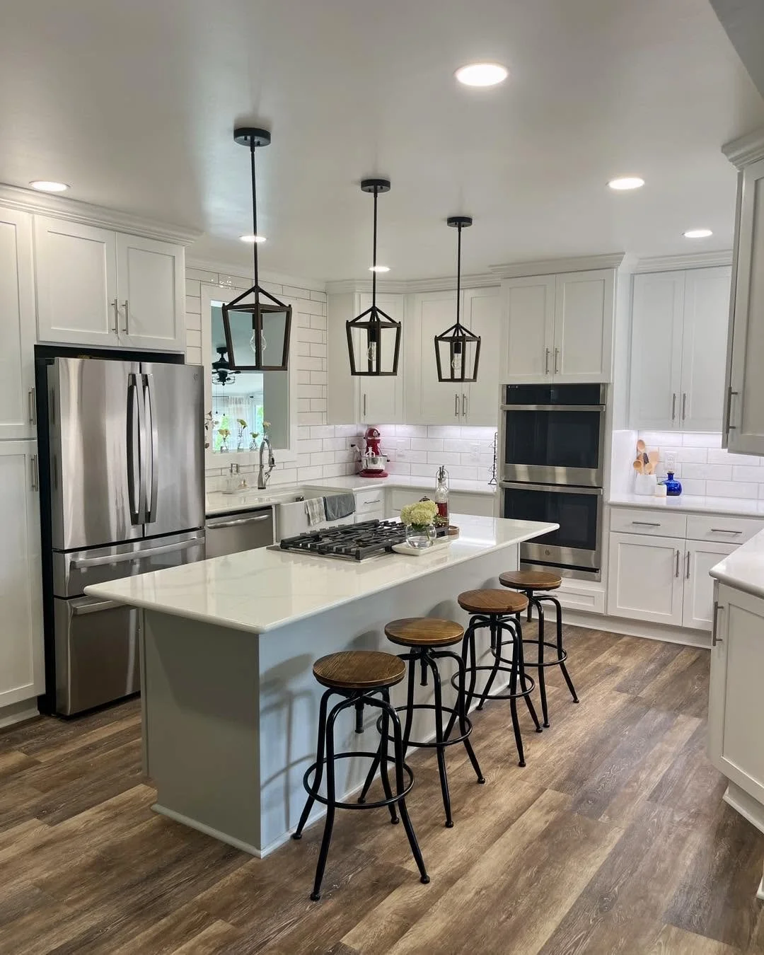 Complete kitchen remodeling with custom cabinetry, countertops, tile backsplash, and modern finishes. Residential kitchen renovation featuring new cabinets, countertops, backsplash tile, plumbing fixtures, and flooring.