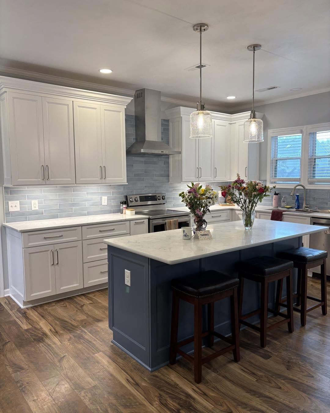 Complete kitchen remodeling with custom cabinetry, countertops, tile backsplash, and modern finishes. Residential kitchen renovation featuring new cabinets, countertops, backsplash tile, plumbing fixtures, and flooring.