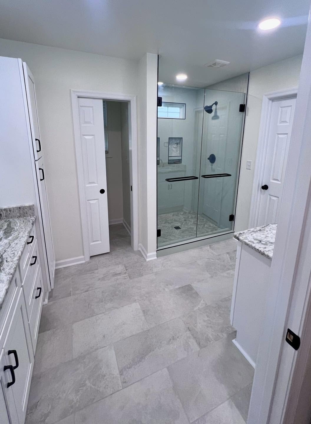 Professional bathroom remodeling and renovation with custom tile, cabinetry, and modern fixtures.Residential bathroom renovation featuring professional tile installation, updated cabinetry, modern plumbing fixtures, and custom layouts.