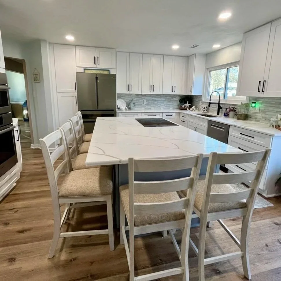 A full kitchen renovation including flooring, cabinets, appliances, tile backsplash, faucets, and plumbing done by Class A contractors local to Portsmouth Virginia and the Hampton Roads area.