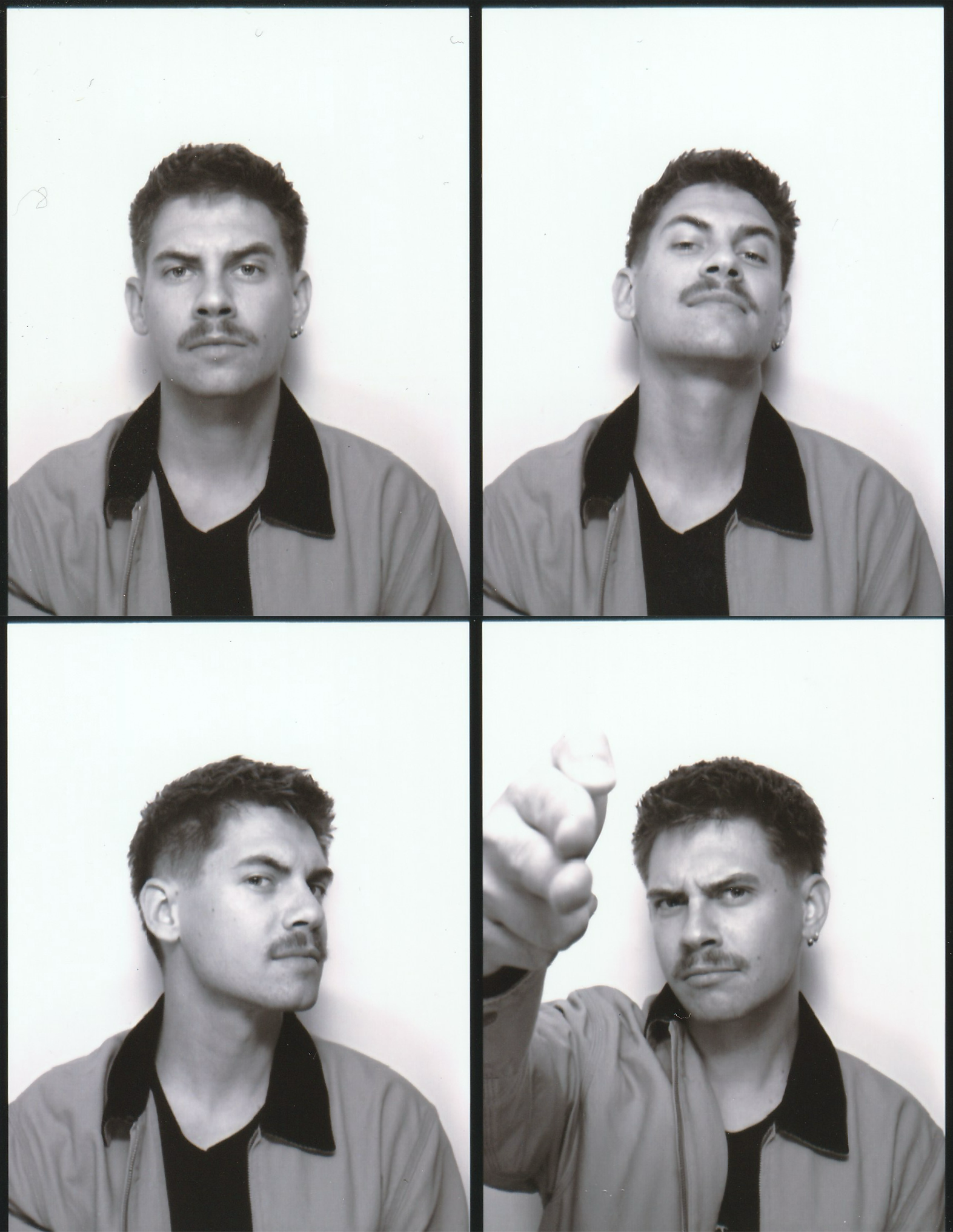 A black and white photo booth strip featuring four pictures of a man with dark hair, a mustache, and earrings. In the top left, he looks serious. In the top right, he smirks with a raised chin. In the bottom left, he looks sideways with a smirk. In the bottom right, he points at the camera with a stern expression.