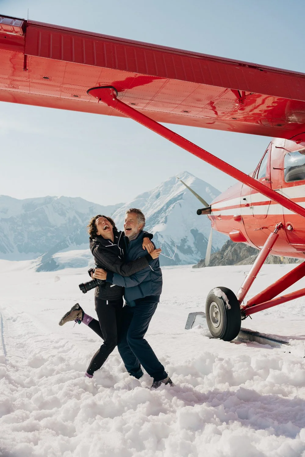 Alaska-Production-Company-Denali-Glacier-Landing-WABU-Creative-Couple-Hugging-072324_0550_RGB.jpg