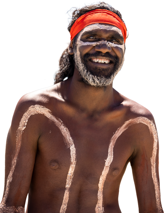 Indigenous man with face paint and body decorations wearing a red headband, smiling in Kimberly, Australia.