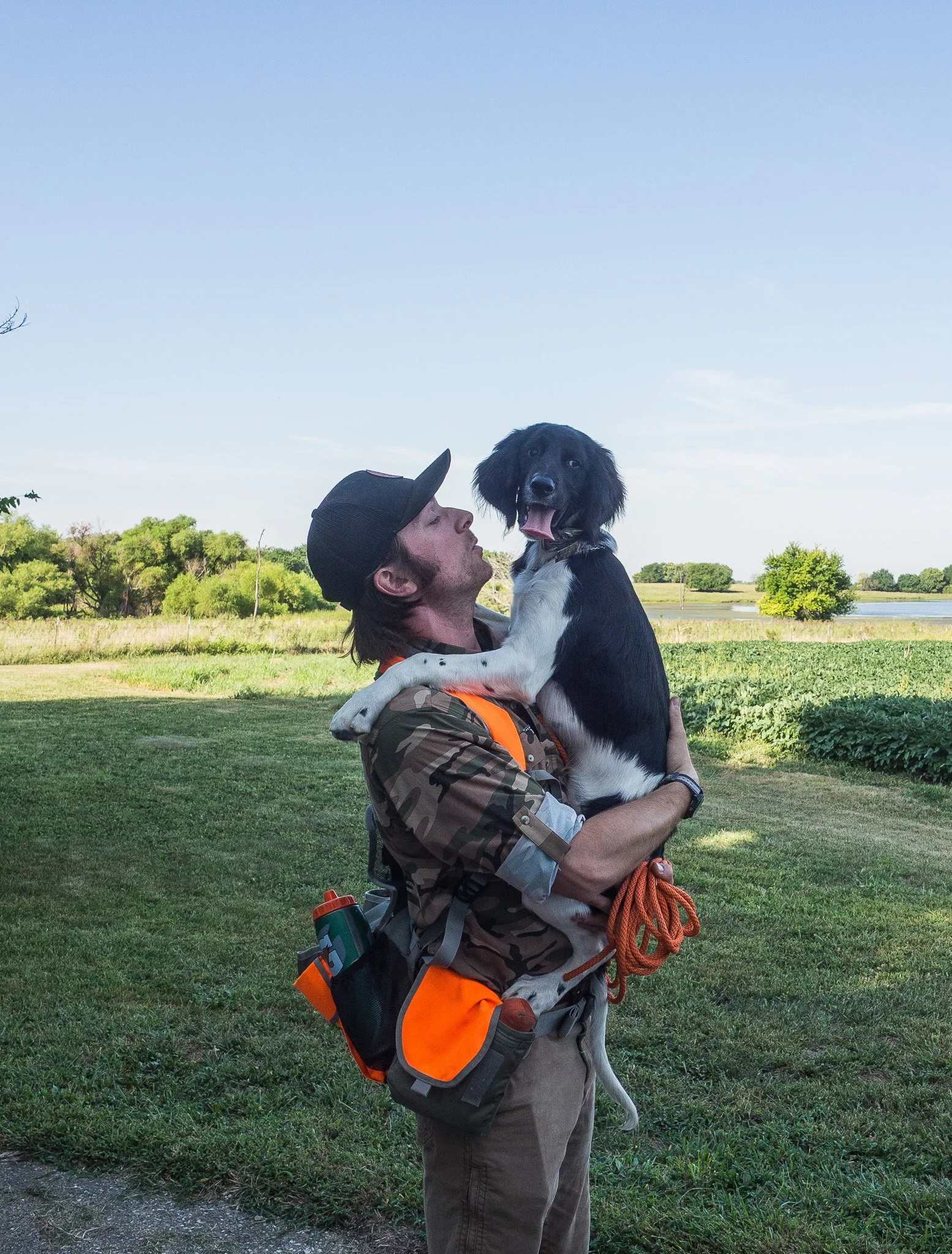 Ian Burrow holding Aldo, a four month old Large Munsterlander versatile hunting dog puppy.