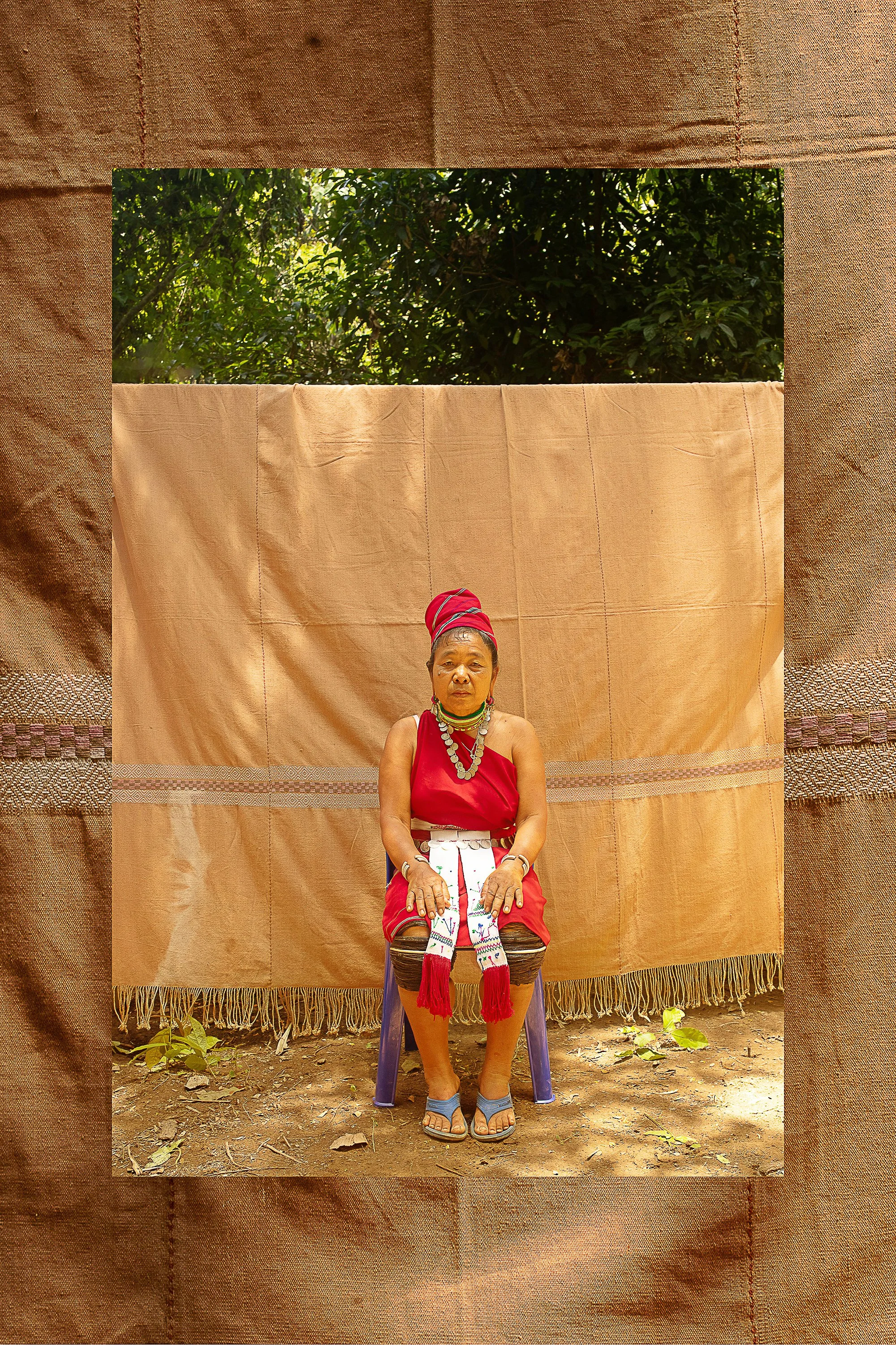 Nga Meh, 55, is still weaving small items when able and proudly wearing traditional attire daily. Her portrait backdrop is a soft brown, naturally dyed handwoven blanket made in 2006 at Mae La Refugee Camp.